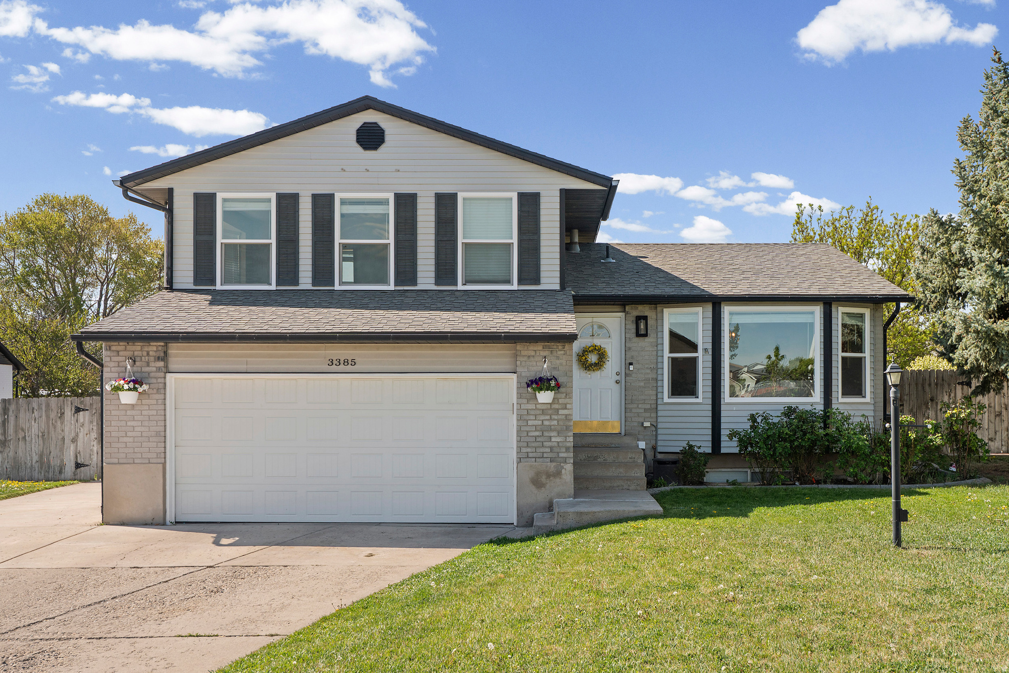 Rare .5 acre lot with a detached garage in the heart of West Jordan. Opportunities like this don't come up often - especially at this price point.  Perfect for car enthusiasts, outdoorsman, gardeners, and anyone needing extra space for their business or hobby. Truly endless possibilities await here.    This 4 bed, 3 bath home offers an updated interior with a thoughtfully renovated kitchen, and new flooring throughout. Highlights include extra storage space or a play room in the basement, a beautiful grey brick fire place in the family room, and new LVP flooring in the kitchen/formal living room. The attached garage has space for two cars, with ample space for more to the east of the garage and in the backyard, which is easily accessed by the east gate which opens to a drive through gate.     Where this property really shines is the ENORMOUS .5 acre lot, with space for your huge garden, playground, chickens, and much more. The generous front yard provides a buffer from the street, and the backyard is fully fenced for dogs or kiddos to run free in their own personal park-like yard. Big enough for volleyball, soccer, toys, you name it. There is a large patio area perfect for entertaining. More than enough room to spread out, but set up for easy maintenance with a fully automated sprinkler system for the yard and garden.     Located in an established neighborhood with convenient access to Bangerter and Jordan Landing. This property is agent owned. Not zoned for goats or large livestock. Chickens allowed.    Square footage figures are provided as a courtesy estimate only and were obtained from county records.  Buyer is advised to obtain an independent measurement.