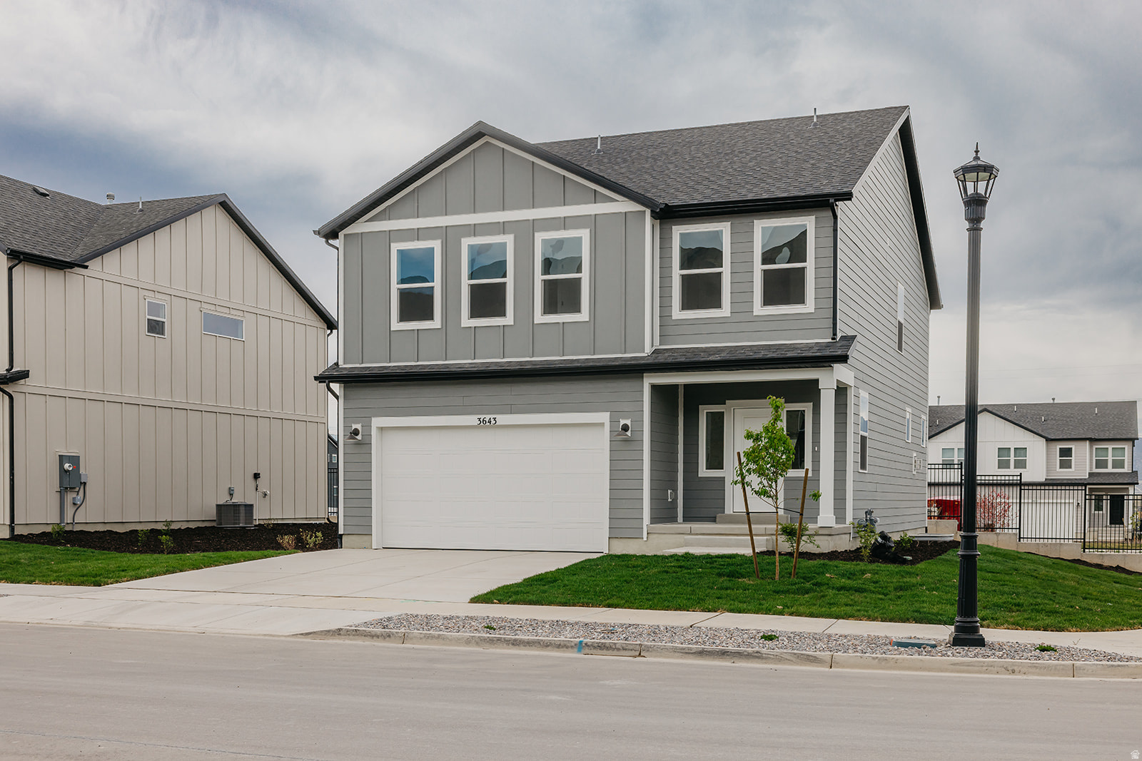 Move-in ready Sweetwater featuring 3 bedrooms and 2.5 baths with a layout designed to impress. The family room showcases soaring 20-foot open-to-below ceilings and a cozy fireplace, creating a bright and dramatic gathering space. The main level also offers 9' ceilings and seamless flow into the kitchen, complete with white upper cabinetry and a large island perfect for entertaining and everyday living. Upstairs, the owner's suite provides a relaxing retreat with a spacious walk-in shower. Ask about available seller incentives when financing with our Preferred Lender! Home will be completed end of March.