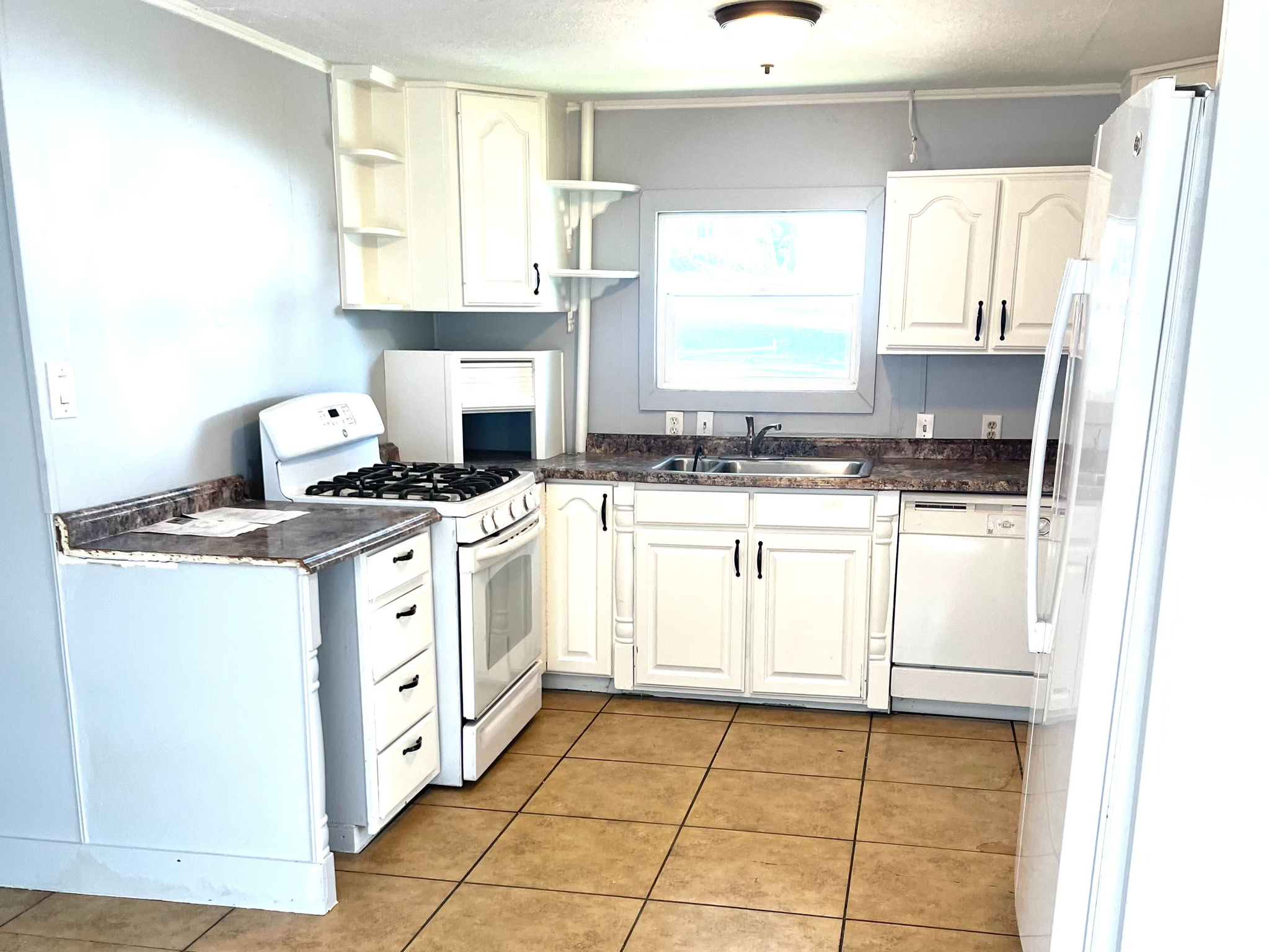 GREAT OPPORTUNITY, ONLY $25,000!!!  Recently painted, a double wide mobile home:  3 bedroom / 2 bathroom, located at the Riverdale MHC Park, offers you comfort, functionality, and a sense of belonging within an affordable budget. Key factors to consider include: Location and Neighborhood: Proximity to work, schools, shopping, and entertainment, are crucial at this location. Close access to Hill Air Force Base, Weber State University, I-84 and I-15. Don't miss this opportunity. Contact us for more info. English/ Spanish