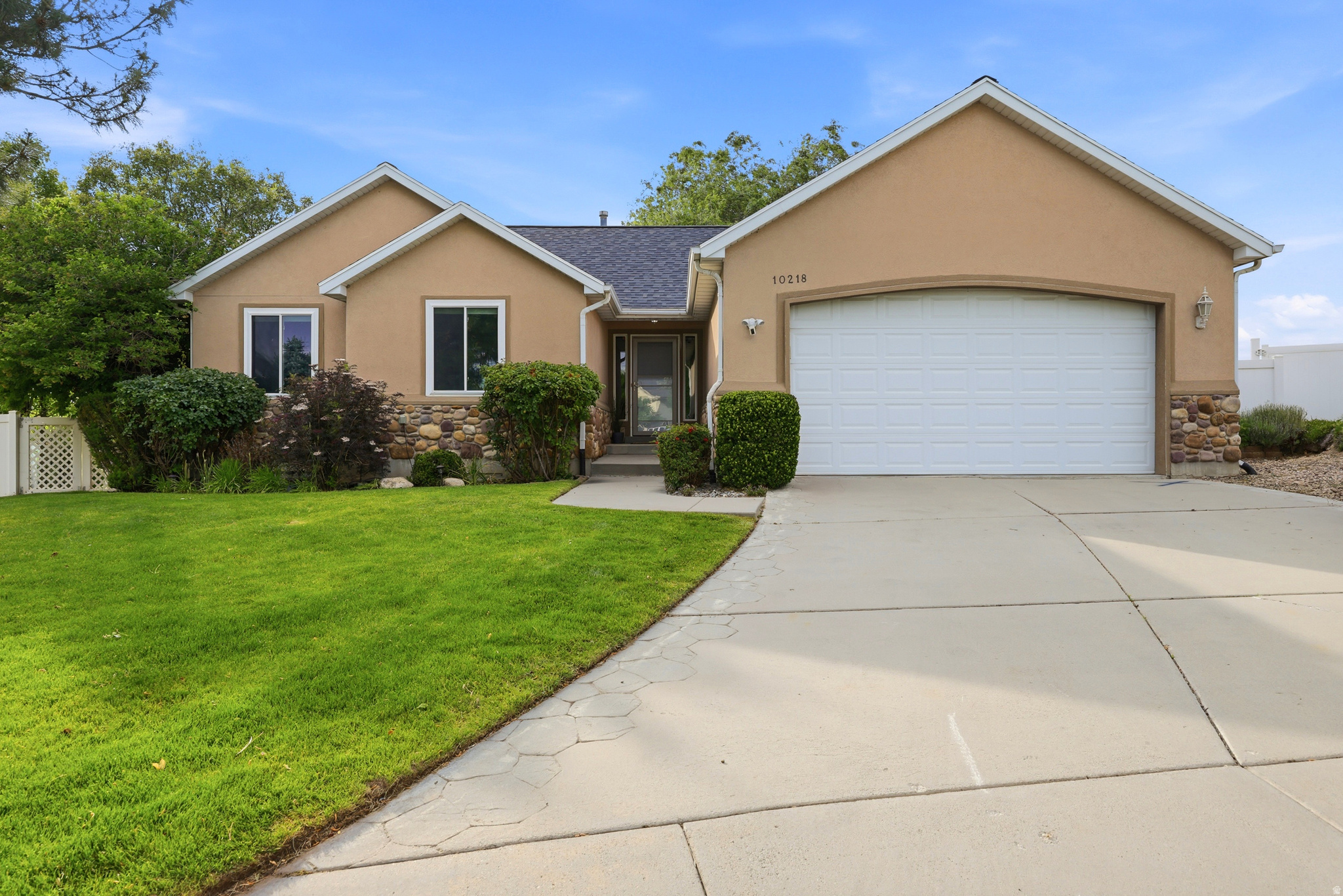 Tucked away on a quiet cul-de-sac in a highly desirable Sandy neighborhood, this beautiful home offers comfort, flexibility, and exceptional outdoor living. The bright, open floor plan features a spacious kitchen with granite countertops, a large island, and plenty of room to gather.  The main-level primary suite includes a spa-like bath with marble flooring, a Euro glass shower, and a walk-in closet. The walkout basement features a full in-law apartment with a second kitchen, making it ideal for multi-generational living, guests, or potential ADU/rental income opportunities (buyer to verify).  Outside, enjoy your own private backyard retreat complete with a covered deck, hot tub, water feature, powered gazebo, fire pit, and raised garden beds. Conveniently located near the Sandy Dog Park, Lone Peak Park, TRAX, and the Porter Rockwell Trail right out your back gate.  A rare combination of location, versatility, and outdoor amenities-this home is one you won't want to miss.  Square footage figures are provided as a courtesy estimate only and were obtained from county records. Buyer is advised to obtain an independent measurement.