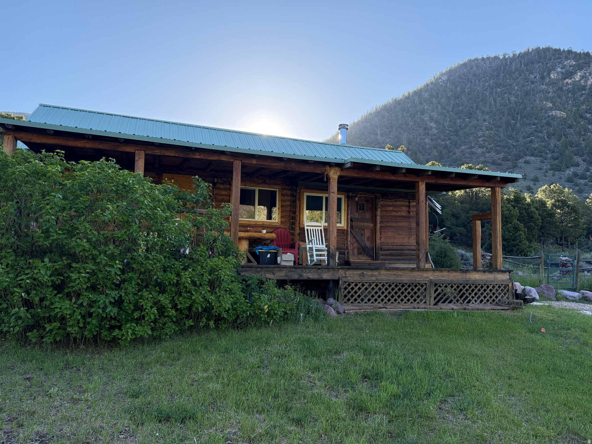 Secluded Recreational Retreat/home/studio/paradise with 1 bedroom, 2 bed lofts and 1 bath on 10 acres of forest property bordering the Ashley National Forest on the Uintah Mountain Range in Northeastern Utah. 100% self sufficient property with pure spring drinking water and solar power. Property includes solar powered cabin, guest cabin, natural spring, horse corrals. There are 2 parcel's included in the sell.