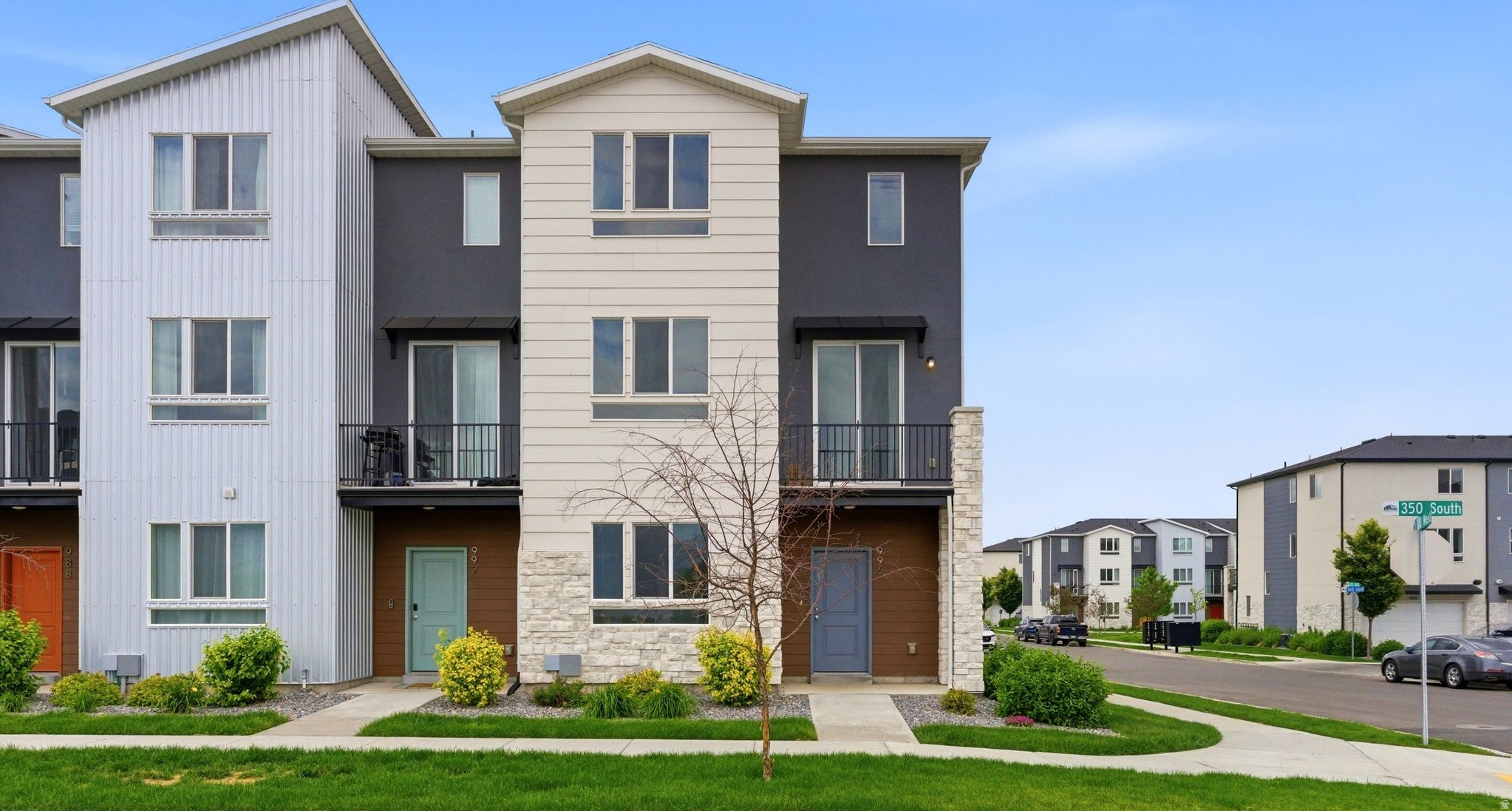 Beautiful row-end townhome in a prime American Fork location with 2 car garage! This spacious 4 bedroom home features an open-concept floor plan with a large Great Room and a stunning kitchen complete with grey shaker cabinets, quartz countertops, a 10 foot island, stainless steel appliances, gas stove, and upgraded hardwood laminate flooring. Enjoy abundant natural light from large windows, 9 foot ceilings, and beautiful views throughout. Relax on your private deck, take advantage of the community pool, and enjoy nearby parks, shopping, dining, FrontRunner, Silicon Slopes, BYU, UVU, and convenient access to I-15 and Pioneer Crossing. Low maintenance living with style, comfort, and an unbeatable location!