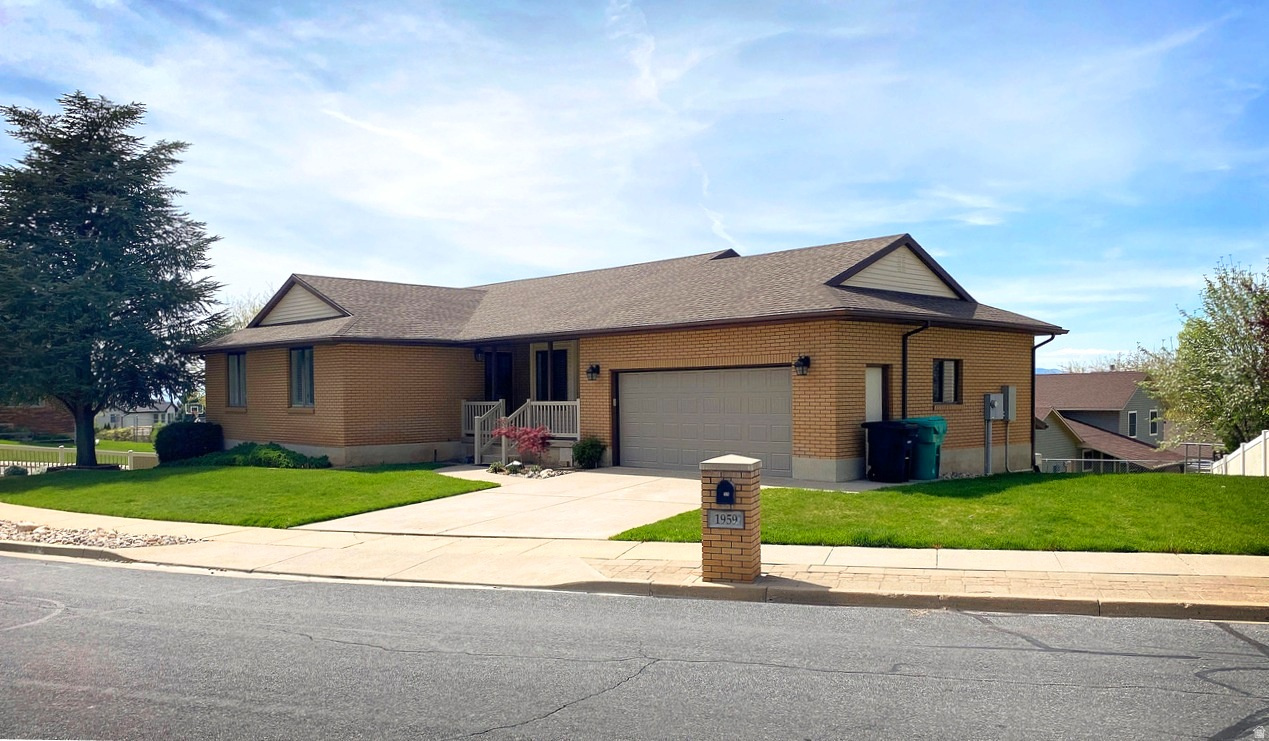 Beautiful brick home for sale in quiet Centerville neighborhood. This home is on a corner lot with an immaculately maintained yard that boasts peach trees, garden boxes and a large, attached workshop! The home was added on to in 2010 creating a spacious open concept living, dining, kitchen area with large windows giving way to breath taking views of the Great Salt Lake. This main area also has an attractive brick, gas fireplace for your enjoyment and warmth. This home has a lot of storage space! In addition to the spacious workshop there is a bedroom-sized storage room with a separate cold storage room. Other highlights of the home are it's big, oversized 2 car garage with epoxy flooring; gorgeous quartz counter tops; 3 bedrooms on the main floor, including a primary suite with a walk-in shower; main floor living room with bay window; new carpet on the main floor; separate office or playroom; huge bedroom in the basement and another large family room with a French door walk-out to the backyard; a new roof; a Generac Standby Generator and foothill trails right out your front door. You'll want to see this home in person to appreciate all it has to offer.