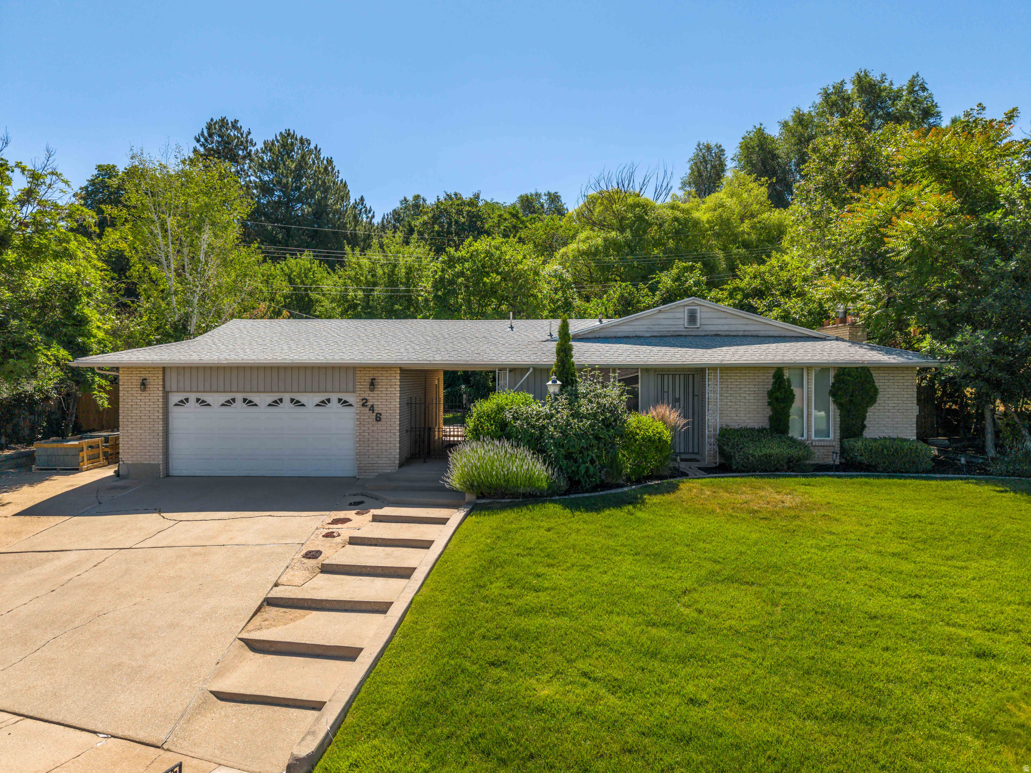 Beautiful all-brick rambler located on the east side of North Salt Lake! This well-maintained home features a beautifully landscaped lot with a private, secluded backyard that's perfect for relaxing or entertaining. Offering 4 bedrooms and 3 bathrooms, the walkout basement provides excellent potential for an ADU or mother-in-law apartment. Recent updates include stainless steel appliances, updated flooring, three-tone paint, vinyl windows on the main level, and the washer and dryer are included. Conveniently located just minutes from I-15 and downtown Bountiful, this home offers both comfort and accessibility. The property has already been appraised, providing instant equity for the new owner. Be sure not to miss the online 3_D tour via MLS!   With so many updates and endless potential, this is an opportunity you won't want to miss. Schedule your private showing today before it's gone!