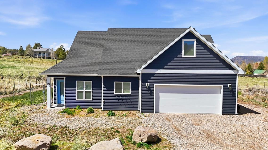 Make this beautiful, five-year-old custom designed and built home your Pine Valley getaway or fulltime residence. A main floor principal bedroom, bath, and laundry provide convenience. You'll love the multi-purpose bunk room for sleeping kids, gardening, hobbies, and extra storage. Enjoy the comfort and convenience of amenities such as a large soaking tub/shower combo, 2 water heaters, an oversized 2-car garage, lots of exterior parking and a fully finished bonus space. Details include custom cabinetry and built-ins, quartz countertops, tile backsplash, LVP and 9' ceilings throughout the main floor. The induction range, 2 refrigerators and washer/dryer are included.You'll appreciate the energy efficient electric heat pump on Dixie Power keeping utility bills in check. The low maintenance wildflower garden attracts birds and butterflies while minimizing outside chores. This fun weekend or everyday retreat is surrounded by open space on a quiet dead-end street with gorgeous Pine Valley views.
