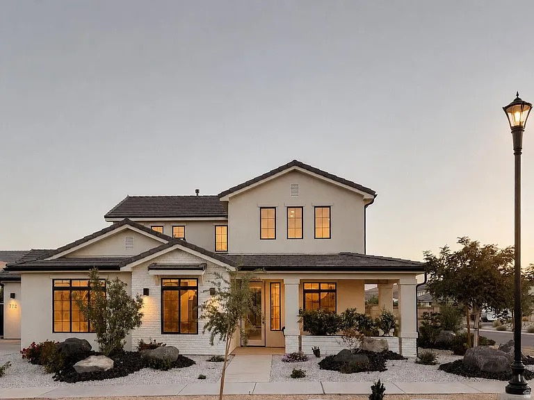 A modern desert showpiece reimagined by designer Emily Barnas...772 W Rust Bluff Dr is a stunning blend of light, texture, and intentional minimalism. This 4-bedroom, 2.5-bathroom home spans 2,978 square feet across two levels. Step inside to soaring 20-foot ceilings, wide-plank floors, and sunlight streaming through high accent windows. The kitchen features contemporary brushed nickel finishes and a Fisher & Paykel refrigerator integrated to match the custom white oak shelving and cabinets... while a moving glass wall system fully opens to connect the indoor and outdoor living spaces. Located within Desert Color, the home includes access to amenities including the 2.5-acre crystalline lagoon, resort-style pools and spas, fitness centers, pickleball courts, parks, the highly desired K-5th Freedom Prep Academy, trails, and dining just moments away. At 772 W Rust Bluff Dr, every detail feels thoughtfully designed. Listing information is provided as a courtesy, buyer is advised to confirm.