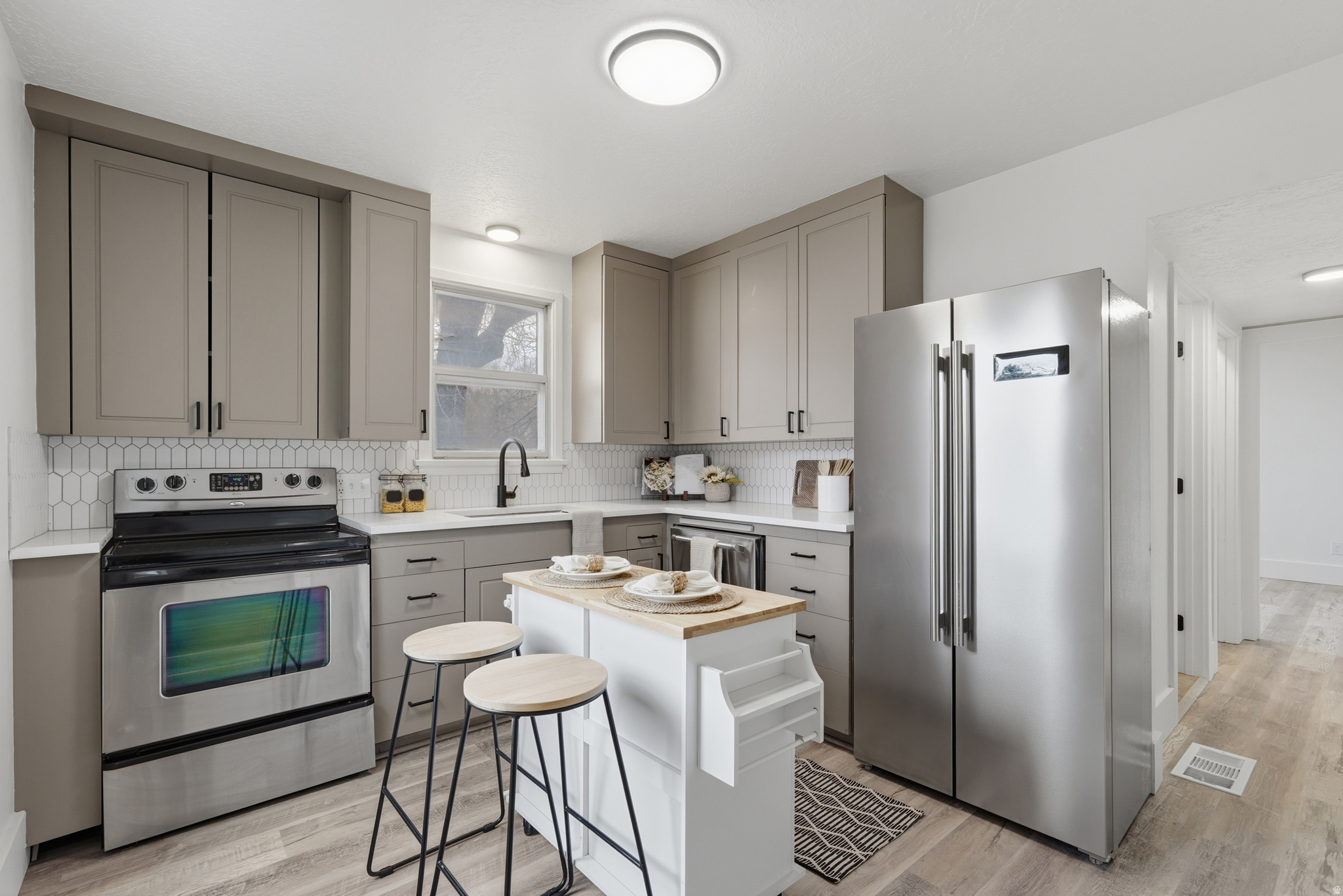 Welcome to this newly renovated 3-bedroom one bathroom condominium! New windows, new A/C, quartz countertops, giant kitchen cabinets, a fresh backsplash and stainless-steel appliances. All work was completed under a permit and passed city inspection making this incredibly convenient. Outside there is a covered patio with an included shed.   The HOA takes care of so much for you - providing walls out maintenance. Open to cash offers.