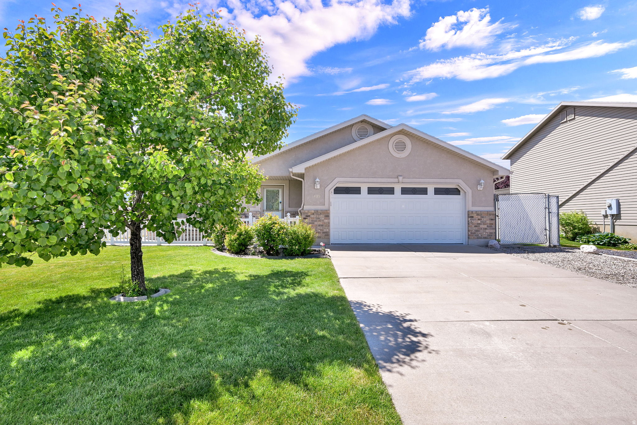 Beautiful single-level home on a desirable corner lot in Harrisville featuring RV and/or boat parking plus a detached shop in the backyard for extra storage, hobbies, or workspace. Inside, enjoy a functional layout with a jetted tub, gas range, and gas dryer hookups. Additional highlights include auto sprinklers and a newer A/C system for added comfort and convenience. Great opportunity with hard-to-find parking and shop space.