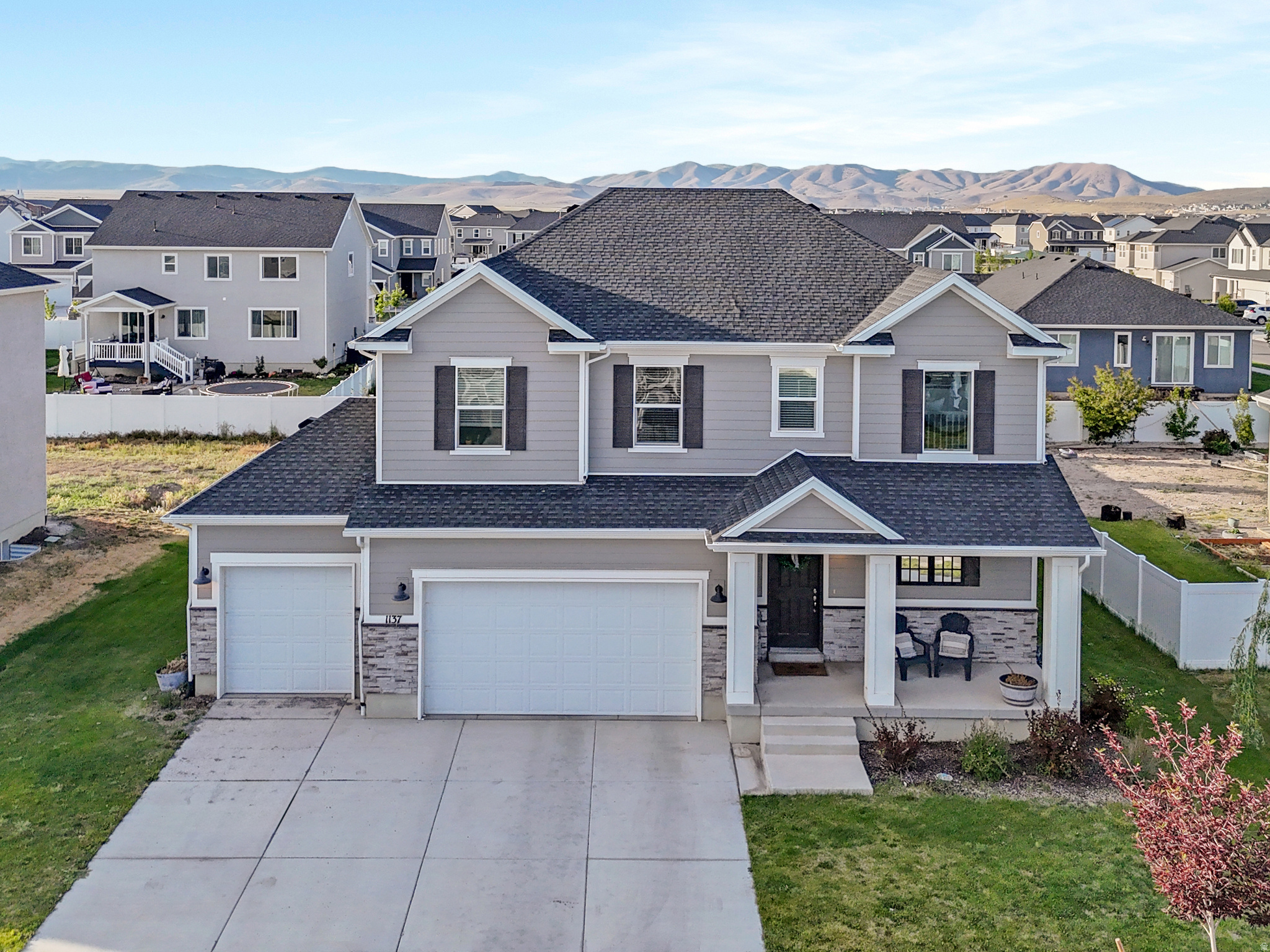** 1% lender credit from preferred lender available** Welcome to 1137 Postmark Place, where modern design, generous living spaces, and everyday functionality come together in one of Eagle Mountain's growing communities. Offering 3,561 square feet, 5 bedrooms, 3.5 bathrooms, multiple gathering spaces, and a finished basement, this home provides the flexibility today's buyers are looking for.  The heart of the home is the stunning chef's kitchen featuring quartz countertops, an oversized center island, abundant cabinetry, stainless steel appliances, double wall ovens, and a convenient butler's pantry that adds both storage and prep space. The open concept layout flows seamlessly into the spacious family room, creating an ideal setting for entertaining, holidays, or everyday living. Upstairs, you'll find a versatile loft that can serve as a home office, play area, media space, or workout room. The spacious primary suite offers a relaxing retreat complete with a large ensuite bathroom featuring dual vanities, a separate shower, and a generous walk-in closet.  The fully finished basement expands the living space even further with two additional bedrooms, a full bathroom, and a large recreation room perfect for movie nights, gaming, hobbies, or hosting guests. Additional highlights include upgraded finishes throughout, bright and airy living spaces, ample storage, a 3-car garage with EV charging station, and thoughtfully designed living areas that adapt to your lifestyle. Conveniently located near schools, parks, trails, shopping, and outdoor recreation, this home offers the space, functionality, and modern amenities that make everyday living easy. This is the kind of home that gives everyone their own space while still bringing everyone together.