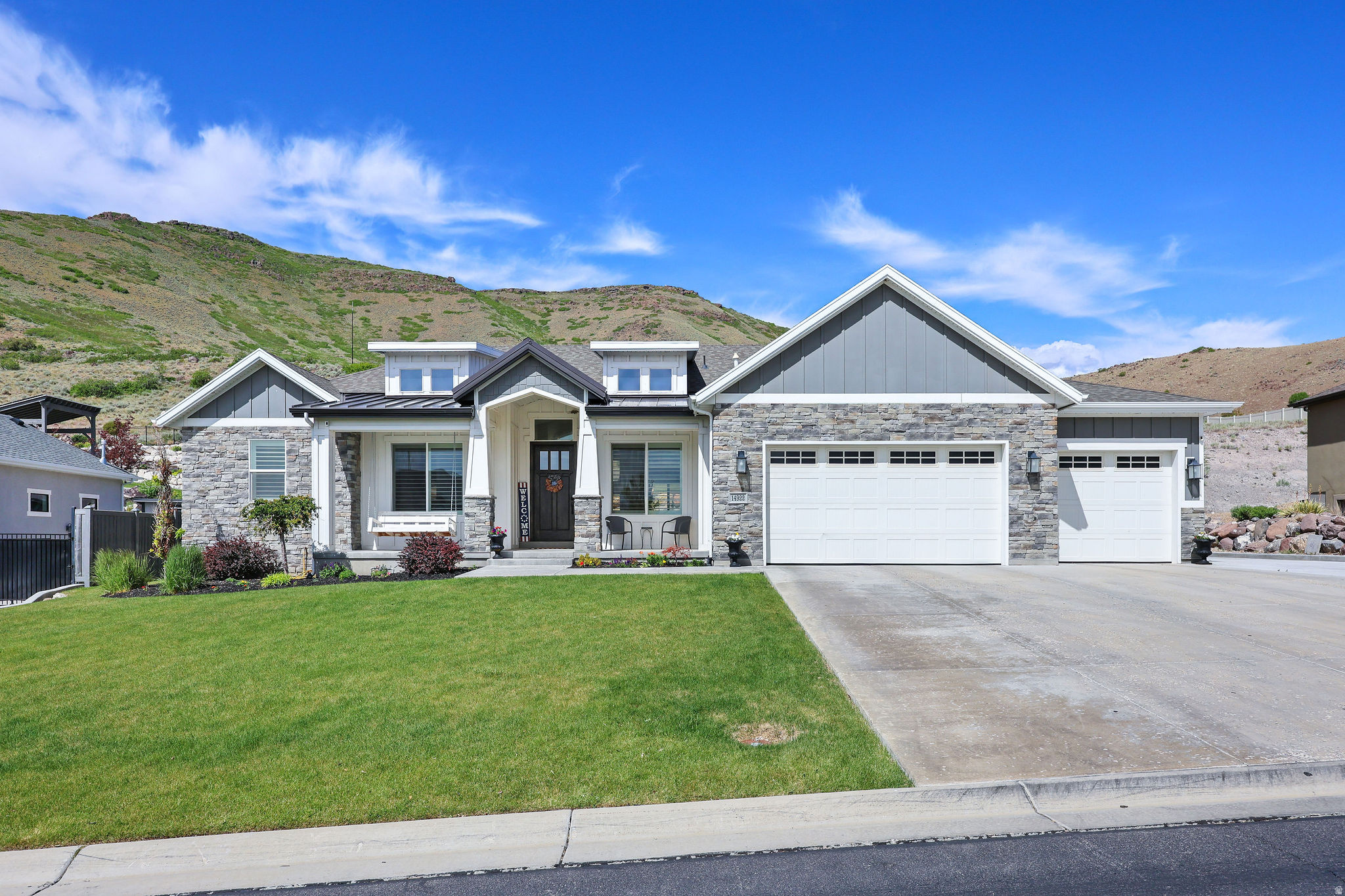 AMAZING Views & Condition!!  Beautiful home in outstanding condition!  Open floor plan upstairs and down.  Granite counters.  Open porch & covered patio to enjoy the amazing lake & mountain views.  All bedrooms with walk-in closets.  Built-in color lights.  Black out shades in master bedroom & basement bedrooms.  Walking distance to Black Ridge reservoir.  Many trails.    Rock walls & tiers in backyard with large area at top level with room for pool, play and more views!!