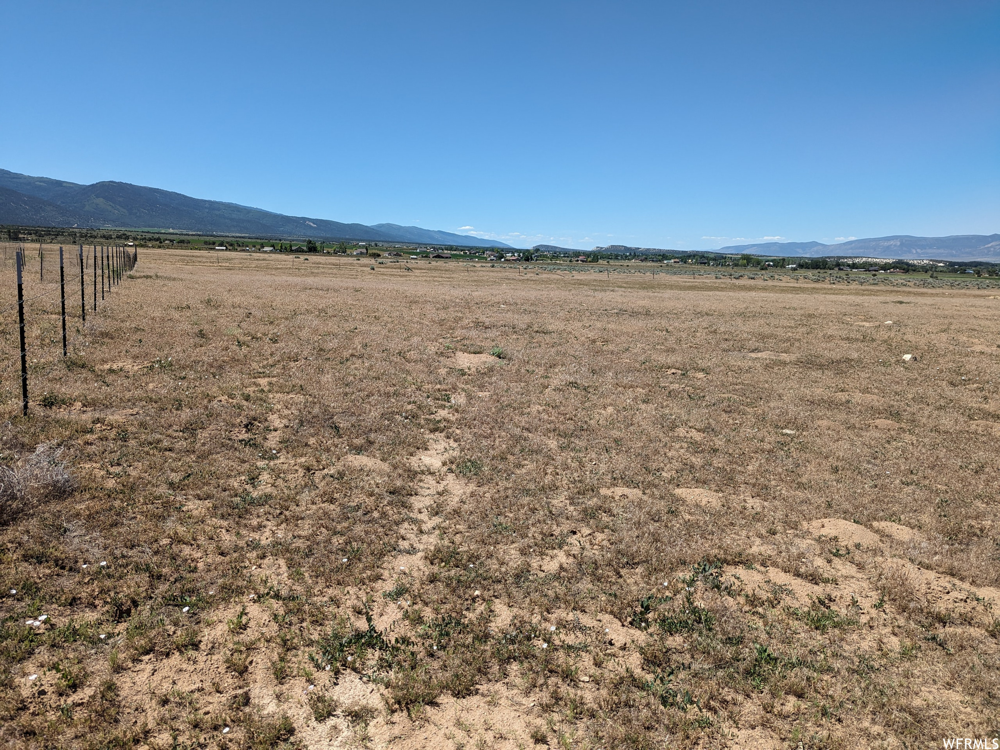 This extraordinary 5-acre piece of private land is a true gem, located on the north side of the picturesque town of Spring City. Purchase includes two water shares with Horseshoe Mountain Irrigation, for use in drilling a well. Additional irrigation shares may be available for purchase. Sewer would be septic. This beautiful, and easily accessed parcel, offers privacy and endless possibilities for your future vision. Buyer is advised to obtain an independent measurement and verify all information.