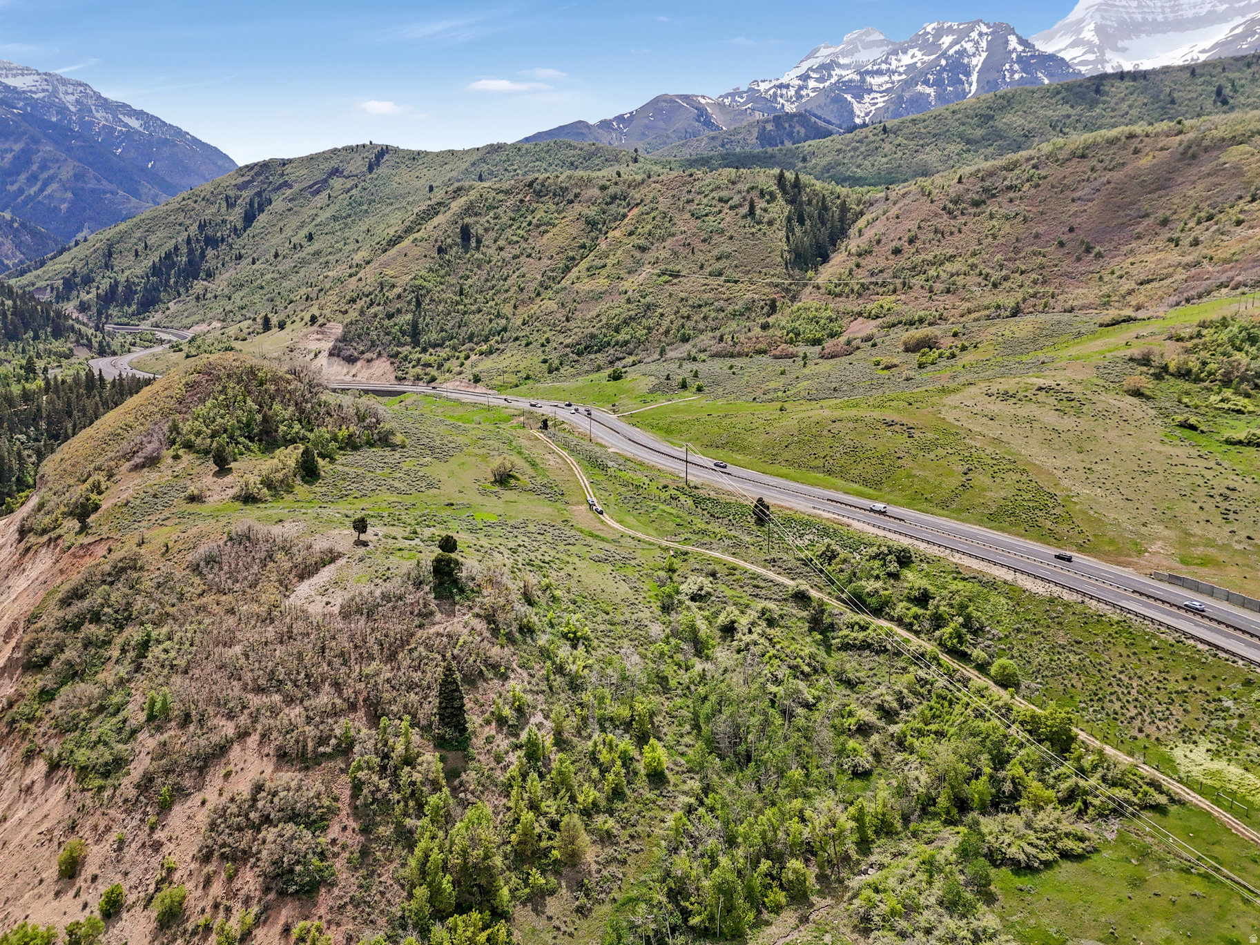 Private, gated-access compliments mile-above-you views in Utah's most scenic alpine canyon on this 5.4 acre property. Includes a deeded water right [55-13607 (a50568)] for a residence and attendant irrigation plus access to a spring and/or well sites. Passed soil percolation test, surveyed, and power lines have been run on the edge of the property. No HOA, no CCRs. The easement to the river is a huge plus for anglers of famed Hoover's Hole, tubers, kayakers and people who simply like watching a river go by.