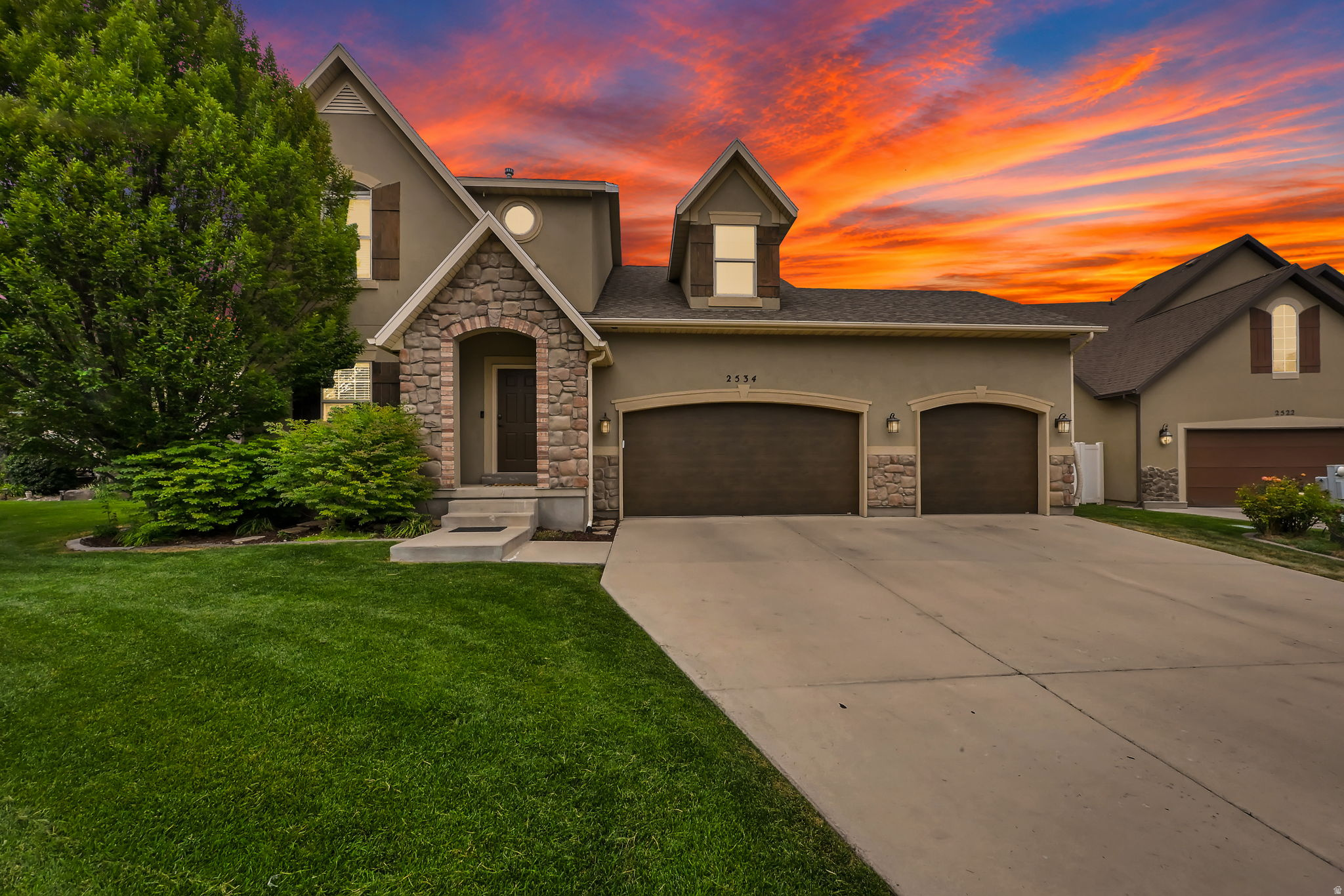 Space, flexibility and an amenity-rich community come together in this beautifully maintained Riverton home. The open main level features vaulted ceilings, abundant natural light, hardwood floors and a statement fireplace, flowing into an updated white kitchen with quartz countertops, stainless steel appliances and a generous center island. The main-floor primary suite offers a spacious retreat with a tray ceiling and remodeled bathroom featuring a freestanding tub, separate shower and double vanity. A dedicated office and additional main-level bedroom add flexibility for work, guests or everyday living, while upstairs offers additional bedrooms and a versatile loft-style bonus space. The fully finished basement provides even more functionality with a wet bar, bedroom, bathroom and multiple living areas, ideal for extended guests, multigenerational living or entertaining. Outside, enjoy a fenced backyard, private patio and nearby green space. Located in the gated Country View community, with gates closed on weekends, the HOA provides front and backyard lawn maintenance, all water, trash and recycling, snow removal, plus access to the pool, clubhouse, fitness room and playground. A three-car garage with extensive shelving and storage completes this exceptionally versatile Riverton home.