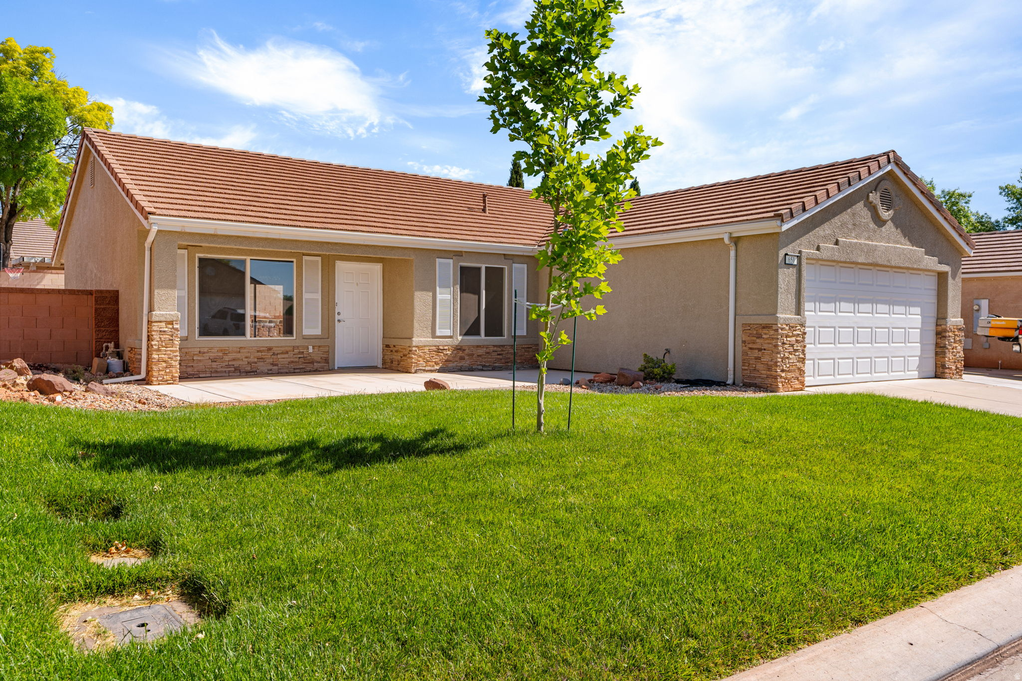 Move-in ready and packed with valuable upgrades, this hard-to-find 4-bedroom home in the desirable Red Rock Canyon subdivision offers exceptional value in one of Southern Utah's most sought-after locations. Recent improvements include a new HVAC system, new water main, new dishwasher, range, and hood, plus exterior flatwork designed to improve drainage--providing peace of mind and reducing future maintenance expenses. Fresh interior paint and new carpet make the home feel clean, bright, and ready for its next owner.  Enjoy breathtaking Red Mountain views, easy access to outdoor recreation, and a location that perfectly captures the Southern Utah lifestyle. Just minutes from Gubler Park, the Ivins Desert Labyrinth trailhead, Tuacahn Center for the Arts, Black Desert Resort, and Snow Canyon State Park, you'll be surrounded by hiking, biking, entertainment, dining, and world-class scenery. **Information deemed reliable but not guaranteed. Buyer to verify all information, including square footage, utilities, rental restrictions, and HOA information, if applicable..