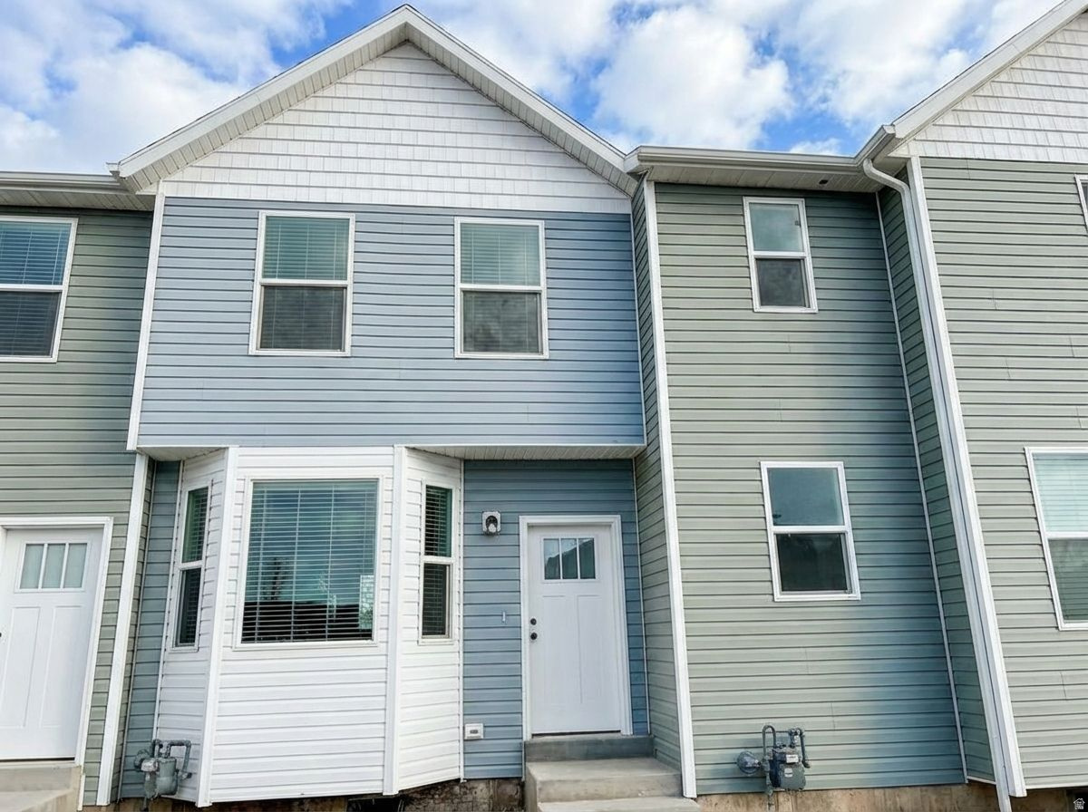 Welcome to this brand-new townhome offering 1,150 sq ft of thoughtfully designed living space with 2 bedrooms and 1.5 baths. Set within a quiet row, the home enjoys beautiful mountain views and a peaceful setting you'll appreciate every day.  The property features xeriscaped landscaping for low-maintenance living and an open patio ideal for relaxing, entertaining, or taking in the surrounding scenery. Open fields to the north and west create a rare sense of space and privacy.  Inside, you'll find an open and functional layout filled with natural light, perfect for modern living. Brand new, beautifully located, and designed for comfort with room to breathe-this townhome offers low-maintenance living in a serene, open setting.  Tax History is based on the lot and not the home built on the lot.  Taxes have not yet been assessed for the townhome.  Square footage figures are provided as a courtesy estimate only and were obtained from building plans.  Buyer ad buyer agent is advised to obtain an independent measurement.