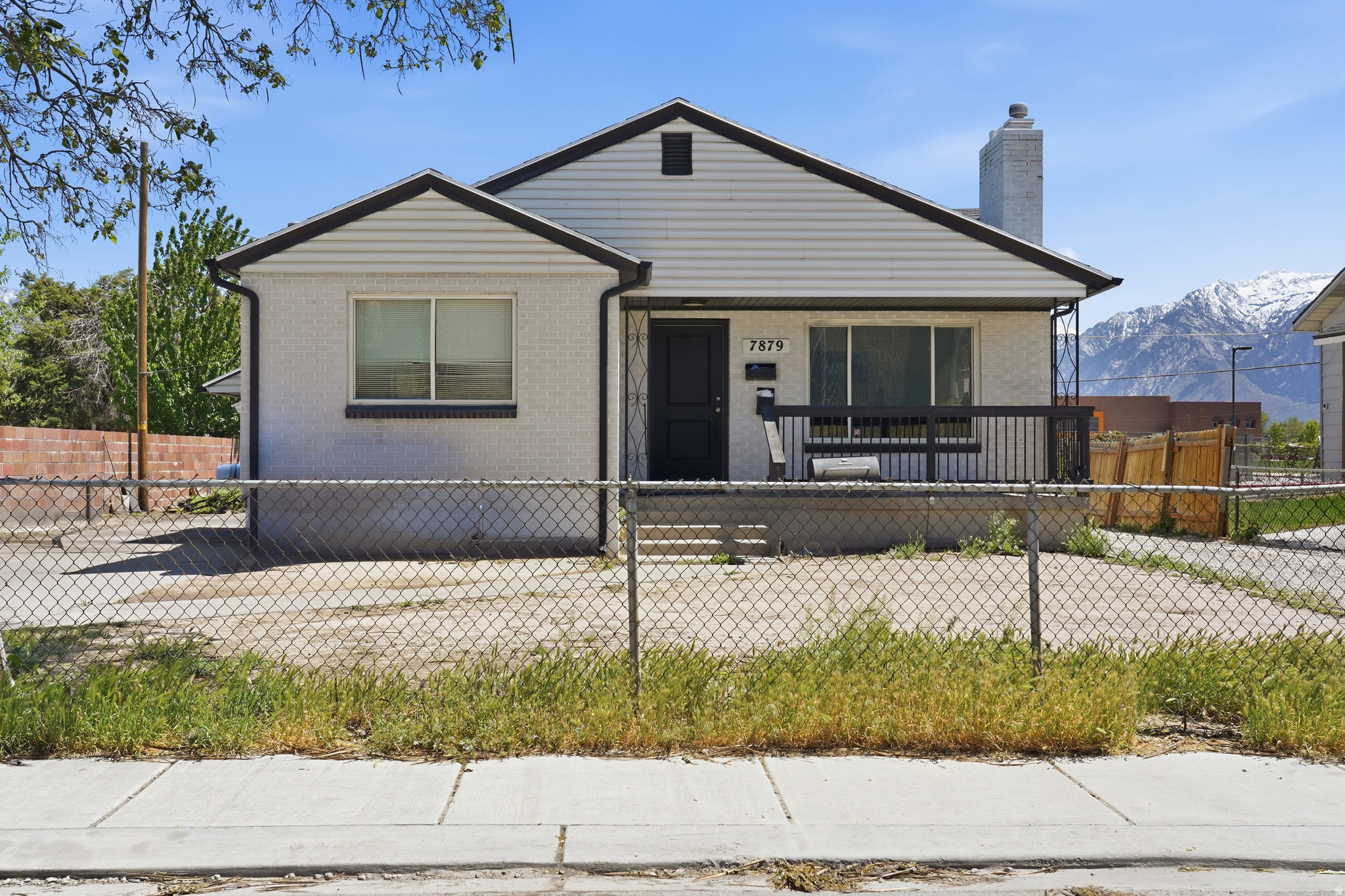 *The Seller is offering a credit to add brand-new sod to the entire yard!* This fully occupied non-conforming duplex with a mother-in-law apartment offers strong rental potential and flexible living options. The property is currently rented month-to-month for $2,550, providing immediate income while still allowing a buyer the option to occupy the home if desired. Previously, the home was rented separately for $1,650 upstairs and $1,350 downstairs, generating $3,000 per month in total rental income, making it an attractive opportunity for investors or house hackers. Both units feature updated kitchens, giving the property a clean, modern feel for tenants or owner-occupants. Major updates include a newer roof and air conditioning system replaced just a few years ago, helping reduce near-term maintenance costs. Conveniently located with easy access to the freeway, TRAX, schools, shopping, and everyday amenities, this property offers both strong rental appeal and practical convenience. Whether you're looking for a cash-flowing investment property, a home where you can live in one unit and rent the other, or just a home with two full kitchens, this property provides flexibility and long-term potential. *The Seller is offering a credit to add brand-new sod to the entire yard.* Some photos have been enhanced using ai to show what the yard would look like with new sod and updated decor.