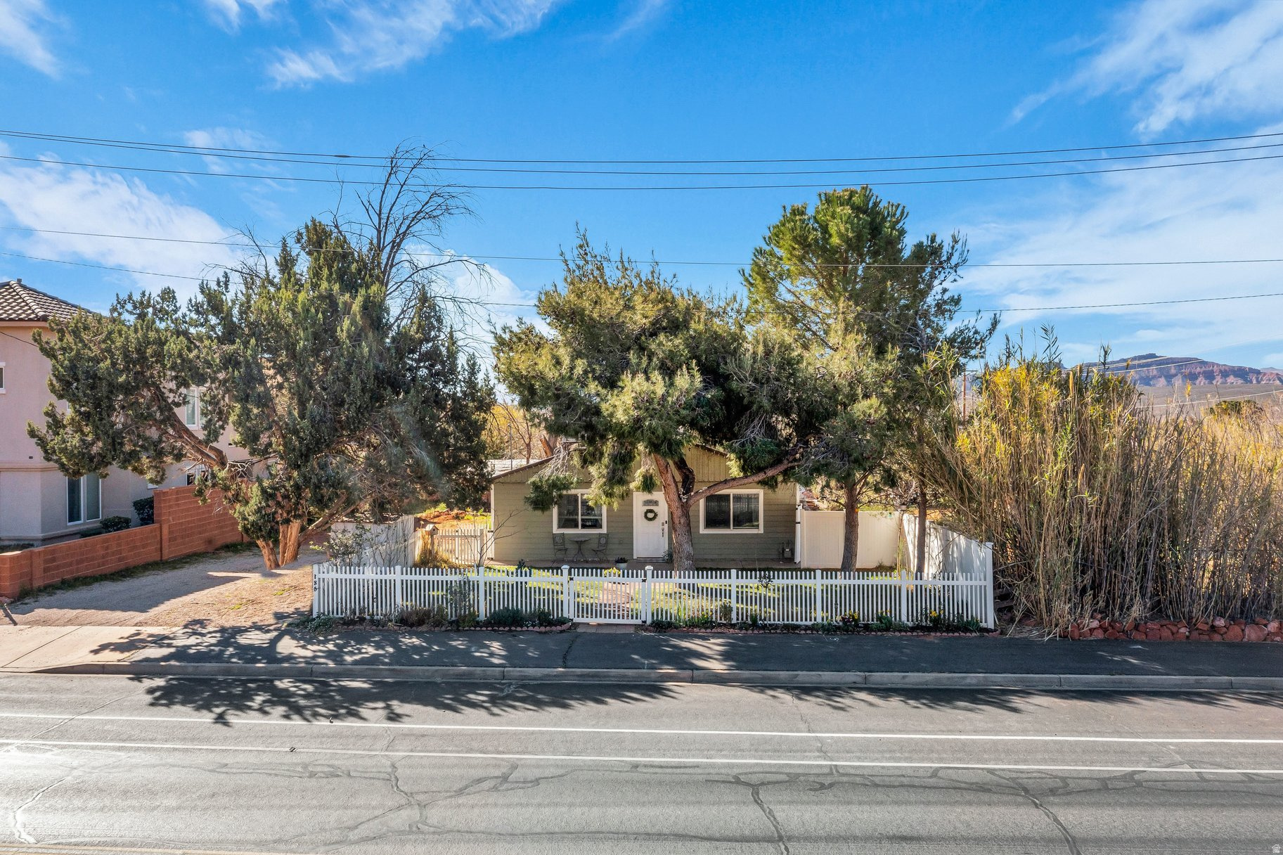 This rare 0.60-acre residential parcel in the heart of Ivins represents a compelling investment and development opportunity where the land's long-term upside significantly outweighs the existing single-family home. In a market where larger infill lots with Red Mountain views are increasingly scarce, this property offers immediate income potential today and substantial value creation through strategic development tomorrow.    Zoning and Ivins City's forward-looking planning support thoughtful density increases, including potential multifamily, duplex/twin home configurations, ADUs, or subdivision - creating a clear path to higher returns as Southern Utah's population and demand for housing continue to surge. Savvy investors can leverage the City's approval process for enhanced residential uses while benefiting from strong rental demand in this desirable location right now.    Prime location amplifies the investment thesis: walkable to Ivins City Park, near a charter school and Red Mountain Market, and just minutes from Tuacahn Amphitheatre, Black Desert Resort, Entrada, and world-class recreation. This central position in one of Washington County's fastest-appreciating areas positions the property for strong appreciation and quick absorption of new units.  For developers and investors seeking land-banked opportunities with lifestyle upside in Southern Utah's red rock corridor, this is a limited chance to secure a flexible, oversized lot in an established neighborhood with proven demand. The investment math is straightforward: acquire now at current pricing, capture rental income during entitlement, then unlock multiplied value through approved density.  Serious investors - schedule a private tour today and let's discuss how this property aligns with your portfolio goals. Don't wait for the next wave of growth to price you out.