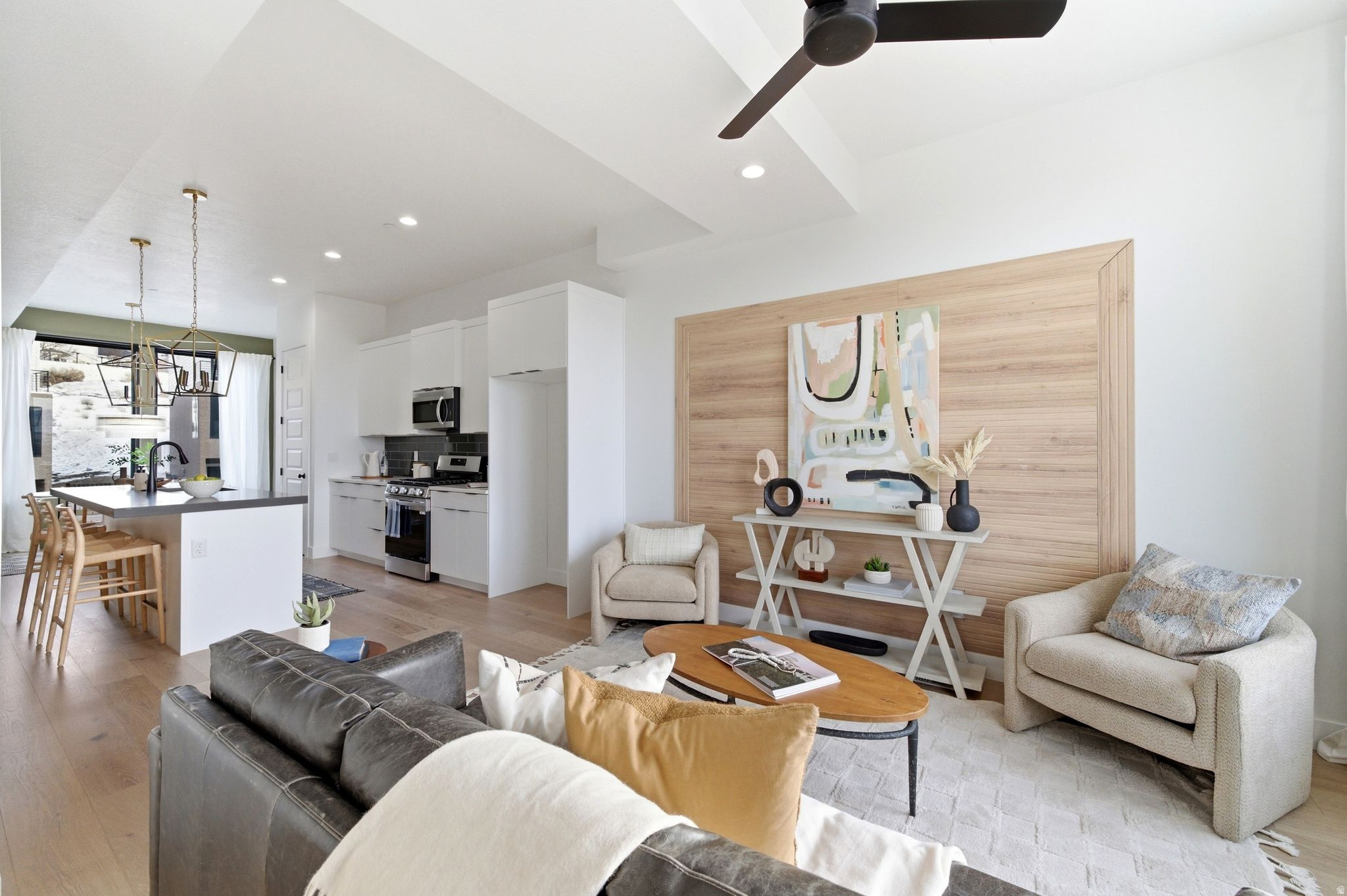 Last few new construction units remaining. Step into this thoughtfully designed 3-bedroom, 3.5-bath townhouse offering breathtaking views of the Salt Lake Valley and modern-day comfort throughout. Large windows invite abundant natural light into the home, enhancing the open and airy feel of each space. The kitchen connects effortlessly to the main living and dining areas, creating an ideal layout for both relaxed daily living and hosting gatherings.   The property includes a one-car garage plus an additional driveway parking spot for added convenience. The spacious primary suite serves as a private retreat, featuring its own en-suite bath and generous closet space. Two additional bedrooms, each with access to full bathrooms, offer flexibility for guests, family members, or a dedicated home office.  Located just moments from outdoor adventures, shopping centers, restaurants, and easy freeway access, this home delivers comfort, quality, and convenience in one of the valley's desirable areas. Enjoy stylish living with scenic surroundings in this exceptional Salt Lake Valley townhouse.