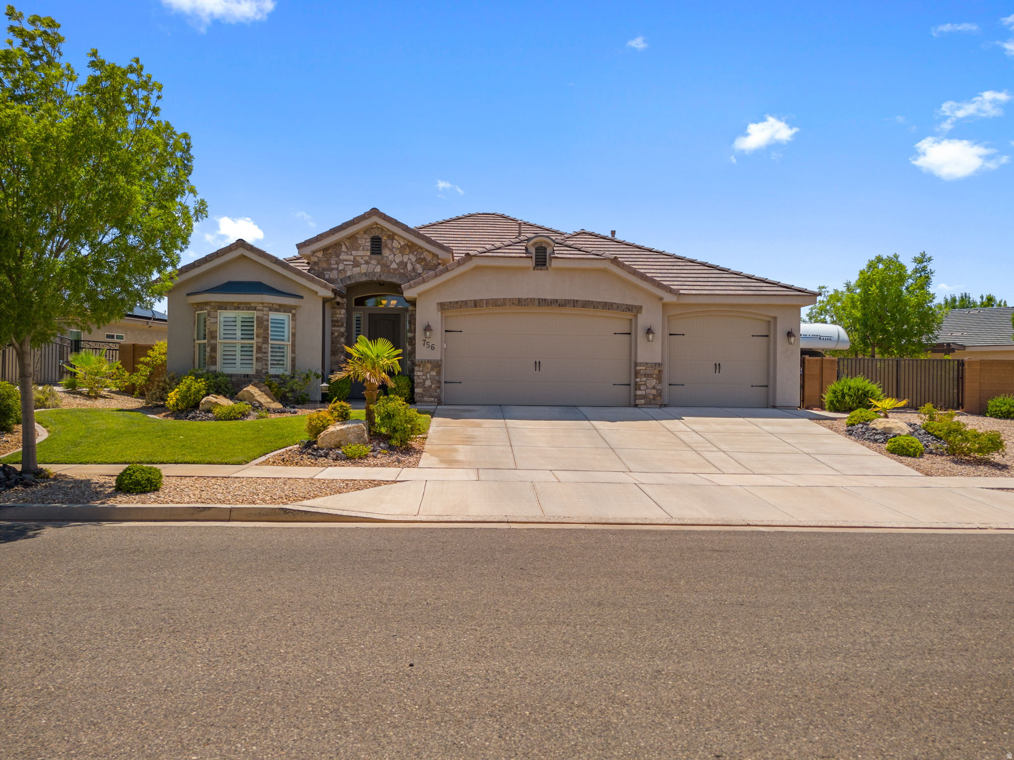 Do you want to live in the St George area?  Well, you better have a house with a pool.  This home comes with that and even more!  Gated RV parking on the side, no backyard neighbors  and easy maintenance yard located on a quiet cul-de-sac.  Home features white cabinets, neutral colors and plenty of rooms for family or guests.