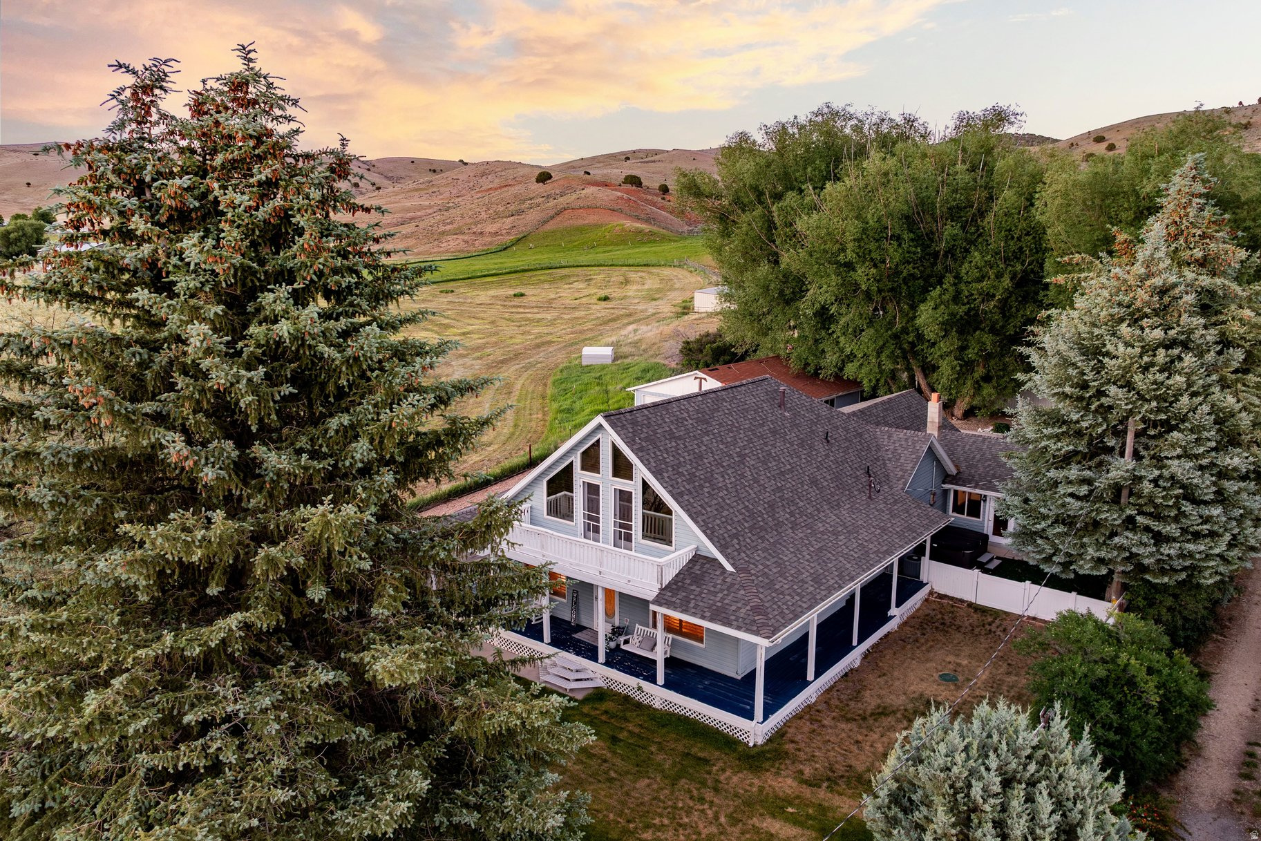 With instant equity after appraising for $890,000, enjoy more value, more charm, and more space at 747 S Hoytsville Road, where country living meets convenient access to Park City's four-season lifestyle. Set adjacent to open farmland in picturesque Coalville, this inviting property offers a peaceful setting that feels worlds away, yet remains within close reach of Deer Valley, Park City, and Salt Lake City International Airport. Echo State Park and Echo Reservoir are nearby for boating, fishing, and summer adventure, while the surrounding area also offers scenic hiking and year-round outdoor recreation. A classic country front porch creates an unforgettable first impression and offers the perfect place to begin the day with a cup of coffee, taking in the surrounding views, open skies, and the sounds of nature. Inside and out, this property delivers the kind of flexibility buyers are searching for, and the oversized detached garage adds valuable space for vehicles, outdoor gear, storage, hobbies, or a workshop. For those looking to stretch their dollar without sacrificing lifestyle, this is a rare opportunity to enjoy a more relaxed rural setting with easy access to skiing, dining, shopping, and travel connections. Deer Valley East Village is one of the Wasatch Back's most important growth corridors, and Salt Lake City International Airport remains a convenient regional gateway, helping position this home as both a lifestyle purchase and a smart location play.