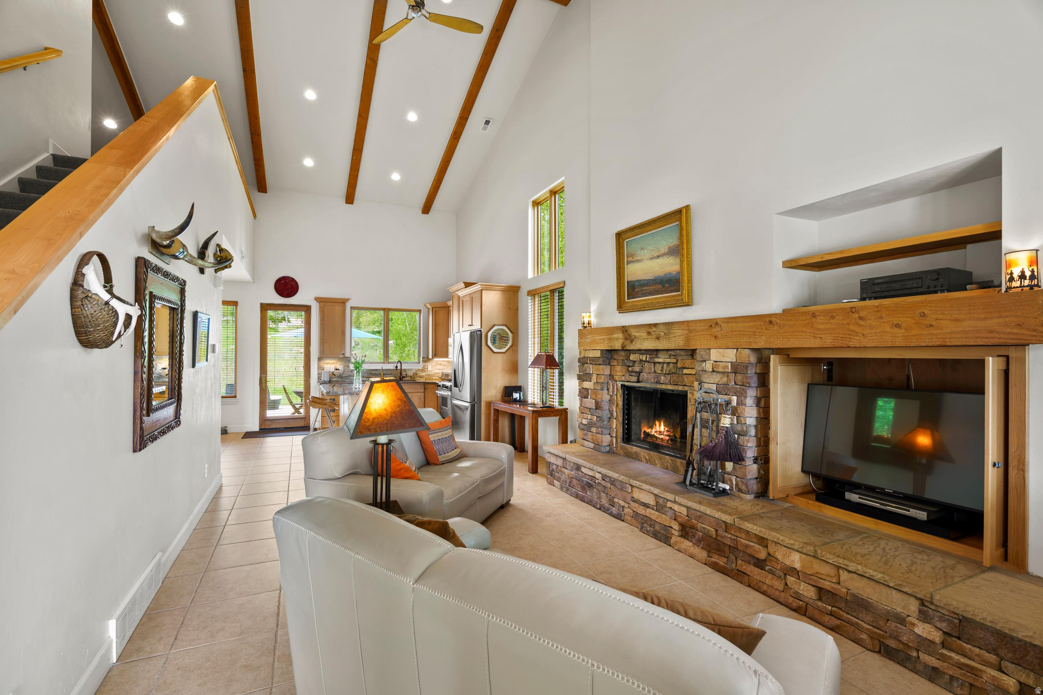 Welcome to this well maintained, fully furnished two-story residence situated in the sought-after Trappers Ridge community of Eden, Utah. Owned and cared for by the original owner, this home occupies a premium corner lot with no anticipated adjacent development, ensuring privacy and preserving the tranquility of its natural surroundings. Enjoy breathtaking views of Pineview Reservoir, Snowbasin Resort, and the Ogden Valley. Ski enthusiasts will appreciate the convenience of the Powder Mountain ski bus stop located just at the corner, offering effortless access to world-class skiing. This thoughtfully designed home features three bedrooms and three bathrooms, perfectly blending comfort with practicality for year-round mountain living or short-term rentals. Added benefits include fully paid solar panels and a Level 2 Wallbox electric vehicle charging station, providing eco-friendly appeal. Step inside to discover an open and airy main living area adorned with generously placed windows that flood the space with natural light while framing stunning views. Vaulted ceilings with exposed beams and a cozy fireplace create an inviting ambiance ideal for both relaxation and entertaining. The main level also includes a convenient guest bathroom and an eat-in kitchen that seamlessly flows into the family dining room, providing ample space for gatherings and everyday living. The primary suite on the main floor offers privacy and ease of access, featuring a spacious ensuite bathroom and a generous walk-in closet. Upstairs, two additional bedrooms, an office area, and a large bathroom offer versatile options for guests, family members, or a home workspace. An extra bonus room is perfect for storage, a secure owner's closet, or a children's playroom. Outside, a spacious patio surrounded by mature landscaping provides natural privacy and a serene retreat, ideal for morning coffee, twilight dinners, barbecues, or enjoying the outdoors throughout the seasons. The homeowners association enhances the living experience with resort-style amenities, meticulous landscaping, and beautifully maintained common areas. This remarkable home harmonizes comfort, elegant design, and a prime location just minutes from premier skiing, hiking, and the natural splendor of Ogden Valley. It represents a rare opportunity in one of Eden's most coveted neighborhoods. With short-term rentals permitted, this property also offers excellent investment potential.