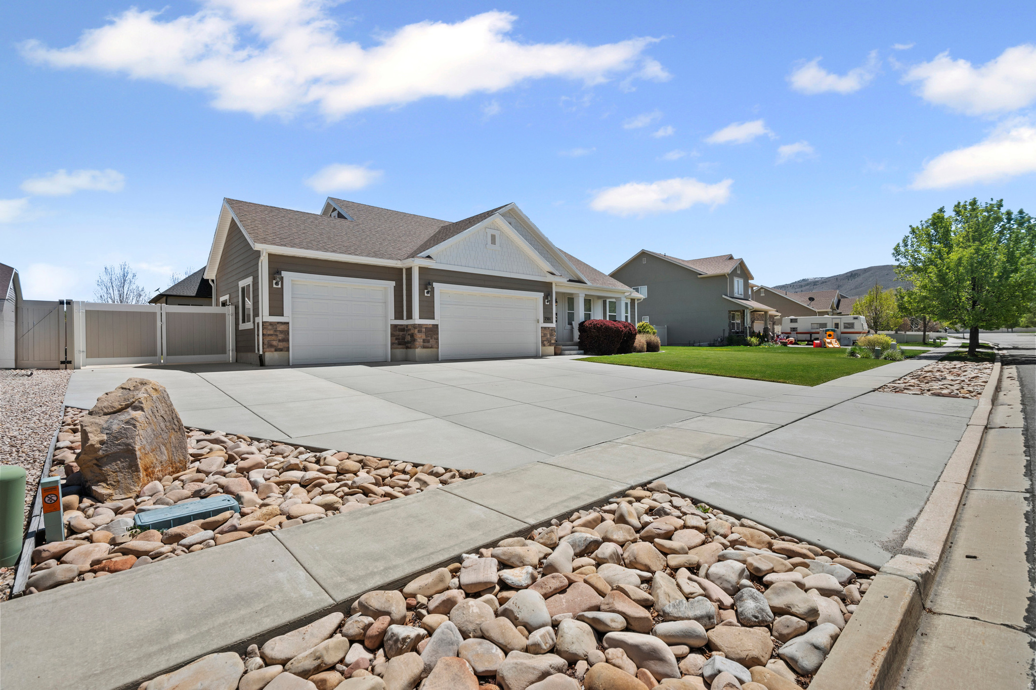 Beautiful rambler located in the heart of Heber City offering space, functionality, and exceptional curb appeal. Situated on a generous .24-acre lot, this 5-bedroom, 3-bathroom home features a desirable open layout, spacious living areas, and plenty of room for entertaining or everyday living. Home features furnace/ac for upstairs, and separate furnace for the basement its own thermostat. The oversized 3-car garage and large RV pad provide ample parking and storage for all your vehicles, toys, and outdoor gear. Enjoy the beautifully landscaped yard with mature landscaping and outdoor space perfect for relaxing, gatherings, or taking in the mountain surroundings. BBQ will stay which is hooked up to natural gas from the house. Conveniently located near schools, recreation, shopping, and all that Heber Valley has to offer. Buyer/Buyer agent to verify all.