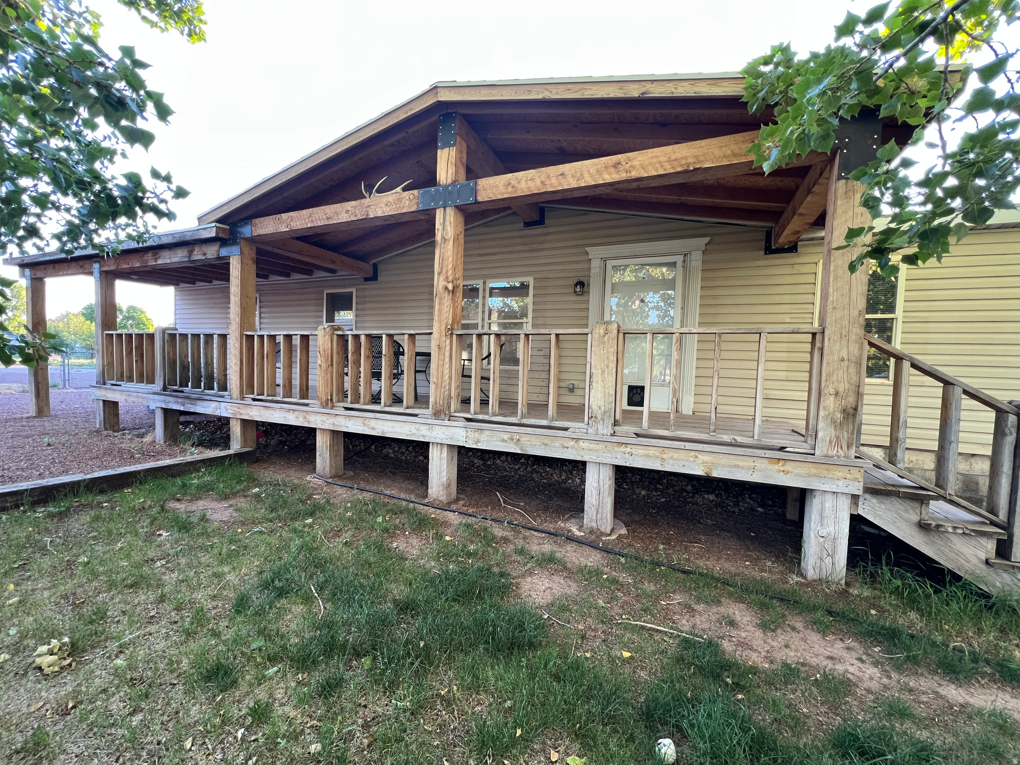 Charming Roosevelt Home with lot next door coming with extra Spacious Acreage and a shop. Welcome to this single-family manufactured home located in the Hancock subdivision of Roosevelt, UT. Built in 2001, this property sits on 2 combined generous 0.48-acre flat lots, offering plenty of open space and country comfort with no HOA constraints or fees.   Spacious Single-Level Living Spanning 1,296 finished square feet, this property is designed entirely for functional single-level living:   Bedrooms & Baths: Features 3 comfortable bedrooms and 2 bathrooms.   Living Areas: Layout includes a dedicated kitchen and dining area, a living room ideal for relaxation.  Finishes: Thoughtful updates flow throughout the home, highlighting durable vinyl, hardwood.   Exterior Details & Utilities Outbuildings & Parking: Bring your projects and gear! The property includes outbuildings/sheds and a detached shop/garage.   Comfort & Systems: Fully equipped with forced air heating and central electric air conditioning to stay comfortable year-round.  Utilities: Complete municipal infrastructure with connected power, gas, and public sewer systems.   Schools: Families will appreciate proximity to Duchesne District schools, including Centennial Elementary and Union High.    Second TaxID = 00-0002-7452 Square footage figures are provided as courtesy estimates only and were obtained from county records. Buyer is advised to obtain an independent measurement.