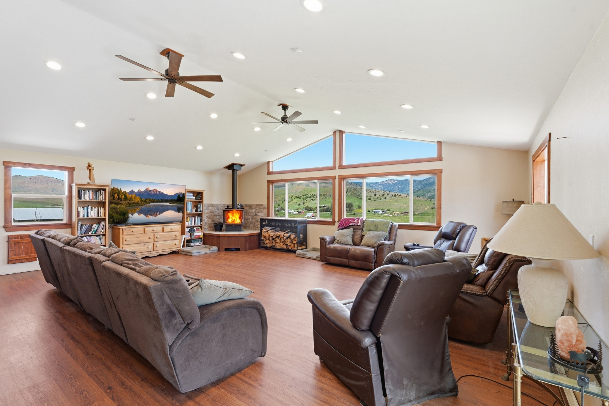 This beautifully updated 4 bedroom, 2 bathroom home offers comfort, charm, and breathtaking mountain views. The newly added living space features stunning picture windows, creating the perfect spot to relax and take in the scenery year-round. Inside, you'll appreciate the tasteful updates throughout and the gorgeous woodwork that adds warmth and character to the kitchen area. Outside, enjoy the established garden area and mature fruit trees that make this property feel like your own private retreat. A wonderful combination of peaceful living, beautiful views, and modern updates all in one inviting home!  The adjacent vacant lot is also being sold MLS # 2157583 and can be purchased to give you even more space!