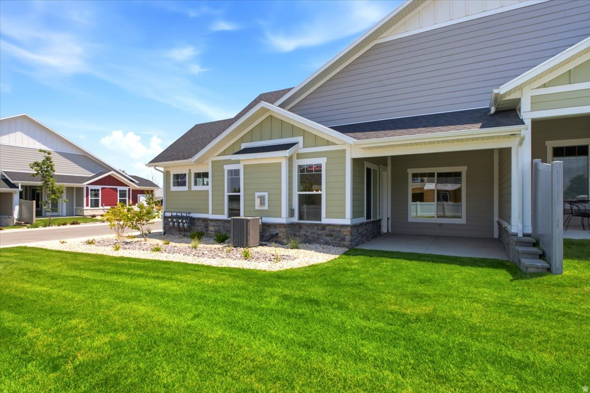 Welcome to The Cottages at Pearce Farm. Our Spruce floor plan offers a thoughtfully designed main-level living with the added flexibility of an upstairs bonus retreat. The open-concept layout seamlessly connects the kitchen, dining, and living area, creating an inviting space perfect for both everyday living and entertaining. The kitchen features a Quartz countertop, a beautiful tiled backsplash, spacious countertop space, and ample cabinetry.  Fireplace.  The main level includes two bedrooms, including the primary suite with a generous walk-in closet and an ensuite bath with a roll-in shower. A secondary bedroom on the main floor provides ideal space for guests or a home office. Upstairs, a large bonus room with an amazing amount of storage and a full bath offers endless possibilities, perfect for a guest suite, media room, or hobby space.  Covered patio.