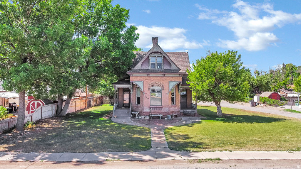 Rare opportunity to own one of downtown Richfield's historic gems featuring an incredible 2,019 sq. ft. detached RV garage and workshop--an exceptionally rare find offering endless possibilities for RV storage, hobbies, vehicles, or a home workshop.  This charming home blends timeless character with today's modern conveniences. Original details include the brick exterior, trim, fireplace, baseboards, casings, and several vintage light fixtures, while major updates include new plumbing and electrical, beautiful hardwood floors, and a new furnace and water heater installed within the past six months.  Situated just one block from the elementary school, the property also offers mature fruit trees, a garden area, and plenty of outdoor space to enjoy. If you've been searching for historic charm, modern updates, and an unmatched garage, this one-of-a-kind property is not to be missed.  AGENT RELATED TO SELLER