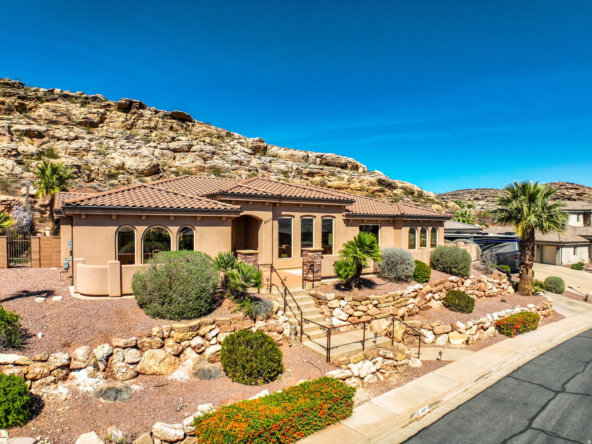 Beautiful custom built home situated on a spacious .63 acre lot in one of Southern Utah's most sought-after neighborhoods. Enjoy privacy and open views with no neighbors behind, creating the perfect backyard retreat. The property features a stunning pool, ideal for relaxing or entertaining while taking in the peaceful surroundings. Inside, the thoughtfully designed single-level layout offers comfortable living and easy flow throughout. Plenty of space both inside and out with room to enjoy and includes RV parking. Conveniently located just minutes from shopping, dining, and scenic hiking and biking trails, this home combines privacy, space, and accessibility in a great location with no HOA.