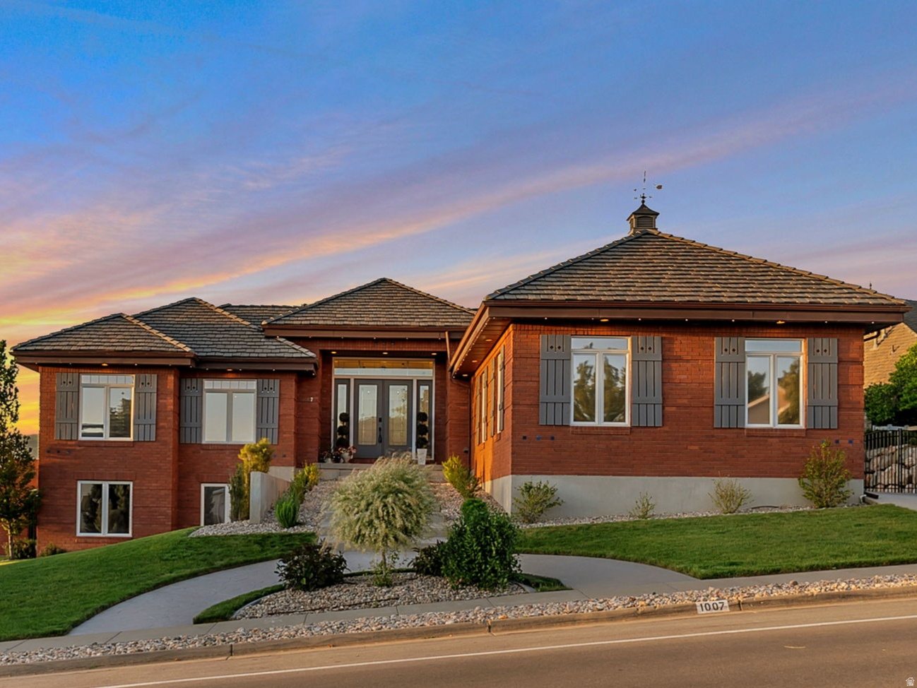 Former Parade of Homes!  These owners continue that tradition of excellence.  Eaglewood Golf Course runs through the neighborhood. 4 car detached garage was added in 2019.  20 feet wide, 30 feet deep with a 10 foot door and 13 foot ceilings, which only adds to the oversized attached 2 car garage!  Bar-tile roof replaced in 2017. Two new A/C units and two new furnaces in 2024! Plus, a new Generac generator in case the power goes out.  So yes, the systems around the home are top-notch!  You'll love the gorgeous hardwood floors throughout the main floor! Owners have remodeled the kitchen and installed all new appliances.  All five bathrooms have been remodeled (four of them down to the studs) and each one is fabulous! In fact, one is a full spa with cold plunge tub, soaker tub and steam shower! Full second kitchen downstairs with entrance into the basement.  The back deck stretches the length of the home and the views can't be beat. Jellyfish lighting around the home! This home is an entertainer's paradise! Full video tour upon request, but COME SEE FOR YOURSELF!