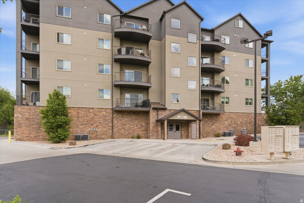 Modern 2019 condo in Holladay's highly sought-after Wolf Hollow community! This bright and open floor plan features quartz countertops, upgraded appliances, an island kitchen, plantation shutters, and abundant natural light throughout. The spacious primary suite offers a private balcony, deep soaker tub, and separate shower for a true retreat feel. Enjoy walk-in closets, two private balconies, elevator access, 2 secured garage parking spaces, and resort-style community amenities. Surrounded by mature trees and green space for added privacy, plus plenty of guest parking. Pet-friendly and rental approved! Conveniently located near schools, shopping, community centers, dining, and quick freeway access for easy commuting.  Square footage figures are provided as a courtesy estimate only and were obtained from county records.  Buyer is advised to obtain an independent measurement.