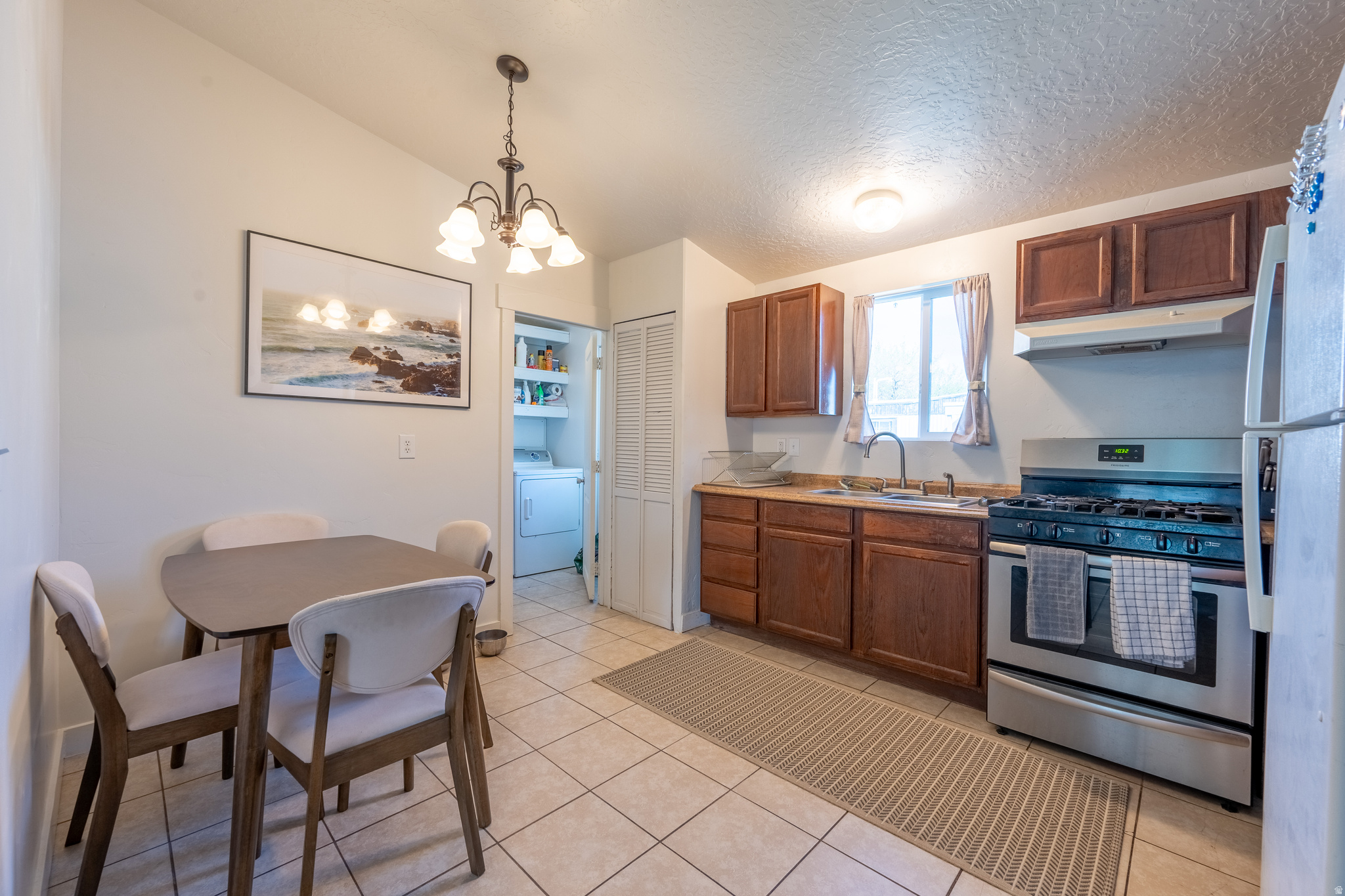 Welcome to this well-maintained double-wide mobile home ideally located near 90th South and just minutes from America First Field (formerly known as Rio Tinto Stadium), shopping, dining, and easy freeway access. Offering three bedrooms and two bathrooms, this home features a functional and comfortable layout with an open-concept living, dining, and kitchen area-perfect for everyday living and entertaining. The primary suite is privately situated on one end of the home, complete with a walk-in closet and an en suite three-quarter bathroom. Two additional bedrooms and another three-quarter bathroom are located on the opposite side, providing separation and flexibility for guests or a home office. Enjoy outdoor living with a large, covered porch, a fully fenced yard with fresh seeding, and a storage shed for added convenience. With five dedicated parking spaces, this property offers rare flexibility for vehicles, guests, or recreational needs. Whether you're looking for an affordable primary residence or a smart alternative to renting, this home offers comfort, space, and a great Sandy location. Schedule your showing today!