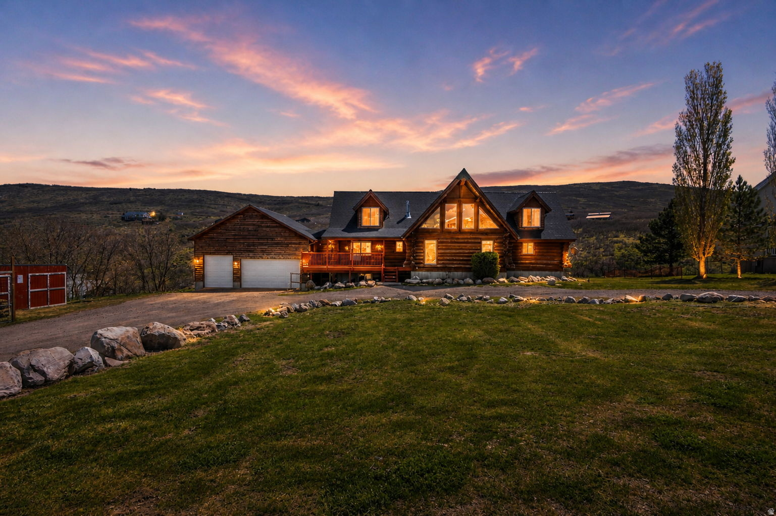 Experience mountain living at its finest in this stunning log home, where rustic charm meets modern comfort. Set on 2.65 acres in High Country Estates, this peaceful retreat offers sweeping mountain views, frequent wildlife sightings, and a sense of quiet that feels worlds away-yet just 15 minutes from shopping, dining, and everyday life. Expansive windows invite the outdoors in, filling the home with natural light and showcasing the beauty of every season. The vaulted great room, anchored by a cozy fireplace, creates a warm and inviting space to gather and unwind. Step onto the wrap-around deck with gas hookup-perfect for entertaining under open skies or simply soaking in the stillness of the foothills. Inside, thoughtful details and warm finishes create a comfortable and inviting atmosphere. A loft-style family room adds flexibility, while the walk-out basement, already framed, offers incredible potential for additional living space or a future mother-in-law apartment. The garage provides ample space for vehicles or recreational gear. Recent updates include a newer HVAC and furnace (October 2024) and two brand new 40-gallon water heaters (March 2026). Located just 1.6 miles up a year-round dirt/gravel road, this property offers the perfect balance of privacy and accessibility. Enjoy clear skies above the inversion, a welcoming community, and the kind of peace that's hard to find-yet easy to call home.