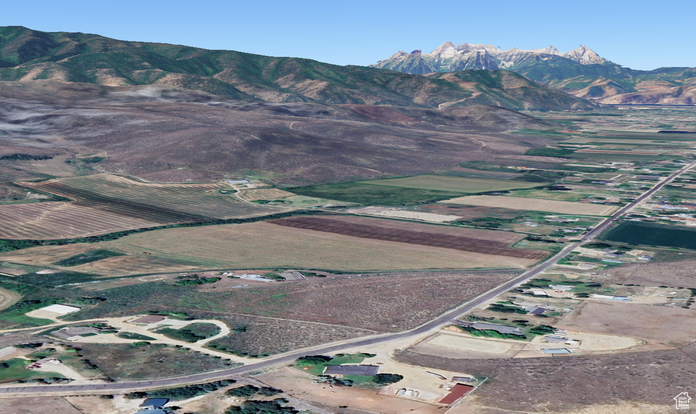 8.89-Acre Parcel on Coveted Center Creek Road  A Rare Opportunity! Discover the perfect blend of country living and breathtaking scenery on this nearly 9-acre parcel east of Heber City, nestled along the highly sought-after Center Creek Road. Offering expansive, unspoiled views of the Heber Valley and the majestic Mount Timpanogos, this prime piece of land is a dream setting for your custom home and small farm with two culinary water shares. The property is primarily flat with a gentle incline toward the western boundary, providing both usability and character. Enjoy the peace and quiet of rural life while still being just a short drive from the conveniences of town. Wildlife is abundant, and the wide-open spaces offer a sense of serenity rarely found. With an included 1/2 irrigation water share, this land is well-suited for gardens or hobby farming. Whether you envision a private retreat, an equestrian estate, or a homestead with room to roam, this is an incredible opportunity to create your ideal lifestyle in one of Heber Valley's most picturesque locations. Now is your chance to own a slice of paradise! All information deemed reliable but not guaranteed. Buyer to verify all information. **Disclaimer: The approximate Lot lines added to the photos were based on the plat map and satellite imagery information found online through the County website, as well as existing fence lines or landmarks.  The lines are not to be considered official lot boundaries, they are approximate and are only for reference purposes.