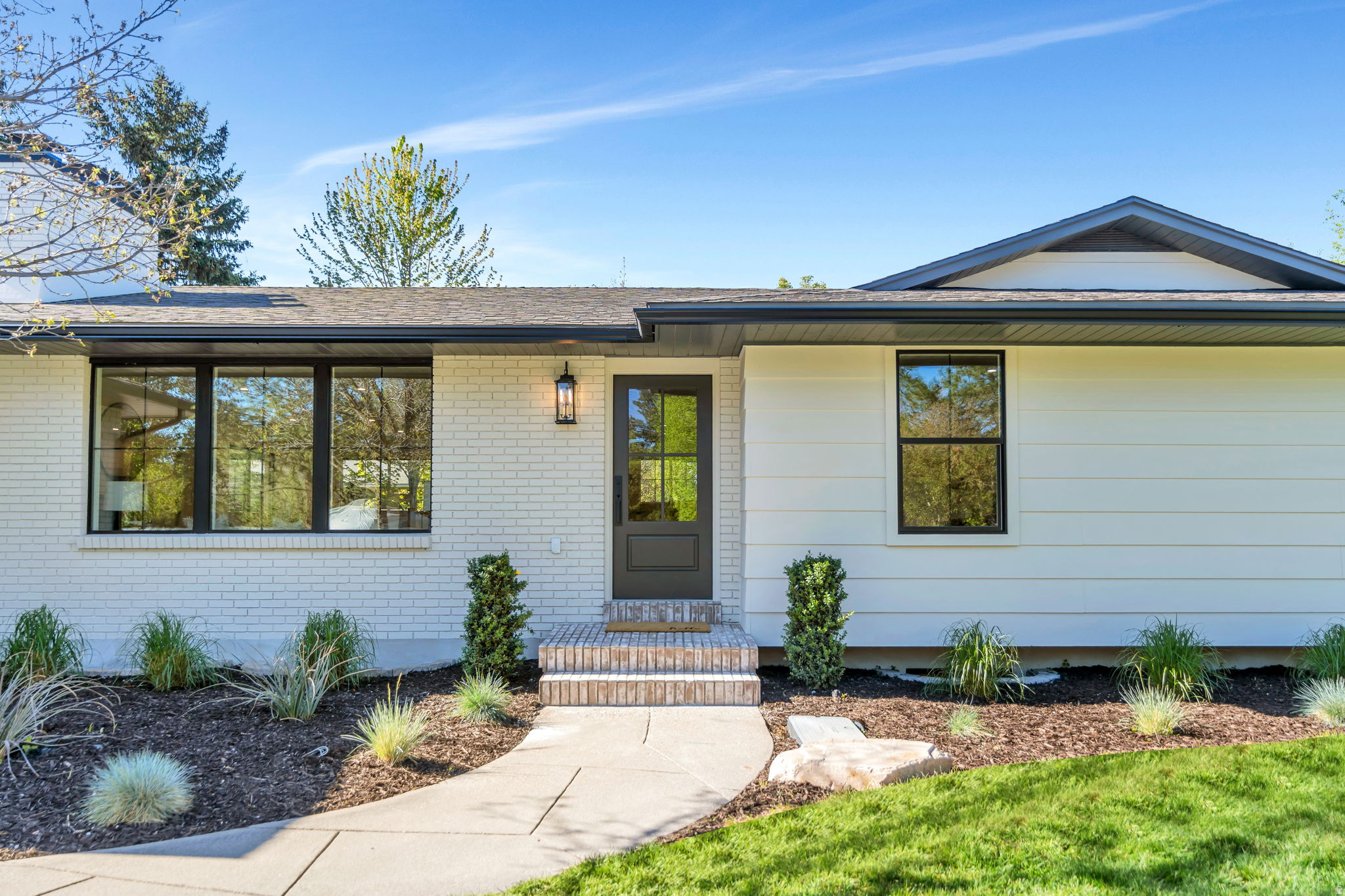 Welcome to 2050 Wildwood Dr, Holladay's newest top-to-bottom, exquisite remodel! No expense was spared and no detailed overlooked in this 5 bedroom, 2.5 bathroom, 3,052 square foot rambler. Let's start with the LOCATION: Is being central important to you? Aside from being in the highly sought after city of Holladay and being located on a street with no exit (no thru traffic) we're also tucked away right off of Highland Drive, which conveniently sits less than 5 minutes from Trader Joes, Whole Foods, the soon-to-be Lifetime Gym, and the 215 entrance. We're also just a short distance from downtown Holladay and local favorites such as Cafe Madrid, Franck's Restaurant, Caputos, Layla Mediterranean, and Sicilia Mia. Whether it's golfing at Old Mill Golf Course, hiking Mt. Olympus, or having a relaxing spa day at Woodhouse Spa, this location has something to offer every lifestyle! Next, UTILITY: Not only does the home have main-level living but the owner left no stone unturned during this remodel.. BRAND NEW: A/C, furnace (dual fuel) electric, plumbing, windows, gutters, tankless water heater, low voltage lighting (front and back), epoxied garage and patio floors, sprinkler system, and insulated garage door. The home also includes laundry on both floors a built-in sauna, dual showers in both full bathrooms, with the downstairs shower being curb-less. You're walking into an established neighborhood without the common trade-off of a home that needs work. Last, but not least: BEAUTY: Imagine walking through your freshly landscaped yard, up your beautiful brick porch, through your new front door to be greeted by the open layout where you can see the warm roman clay fireplace burning, the Taj Mahal countertops and backsplash meeting the new custom white oak slim shaker cabinets. The powder room has a beautifully lit Cristallo Quartzite countertop that will impress any visitor as well as a skylight in the primary bathroom. The white oak railing (which matches the beam) leads you downstairs where you can enjoy a drink from Taj Mahal wet bar while you warm up next to the second fireplace. Or head down to the sauna to relax after a hard workout! This home is one of a kind, no corners cut, no expense spared, and every detail meticulously overseen by the owner, Alignment Homes. Come, take a look, and become Wildwood's newest proud owner.