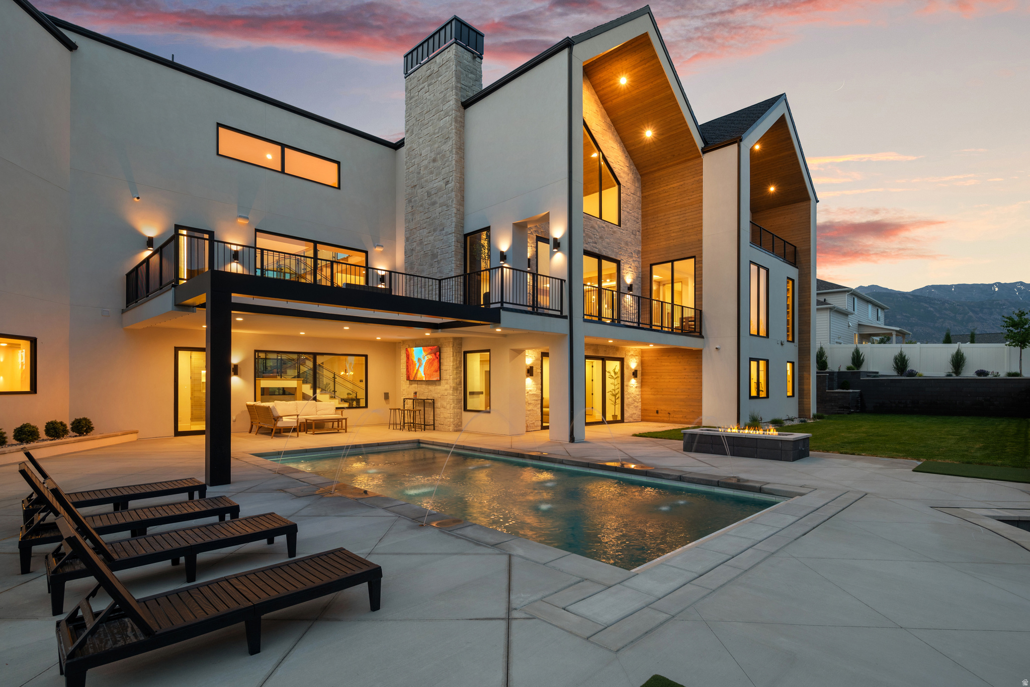 An Architectural Estate Without Compromise! Kaizen Custom Homes proudly presents its 2026 Parade Home - a fully furnished architectural estate designed by Hebdon Studios with interiors curated by Eclectic Design. Spanning over 10,000 square feet, this residence is defined by scale, craftsmanship, and elevated detail. Architectural ceiling treatments create dimension and drama throughout the home, setting the tone for refined luxury from the moment you enter. The main level primary suite is designed as a true sanctuary, while five additional large bedrooms each offer the comfort and privacy of their own ensuite bath. The lower level transforms into a private entertainment and wellness destination complete with theater room, expansive family and game space, kitchenette, and a dedicated gym featuring sauna and cold plunge. Outdoor living mirrors a five-star resort experience with multiple covered decks, pool, and putting green, all professionally landscaped for seamless indoor-outdoor flow. Fully furnished and design-complete, this home offers an immediate luxury lifestyle without the 12 to 18 month build timeline.