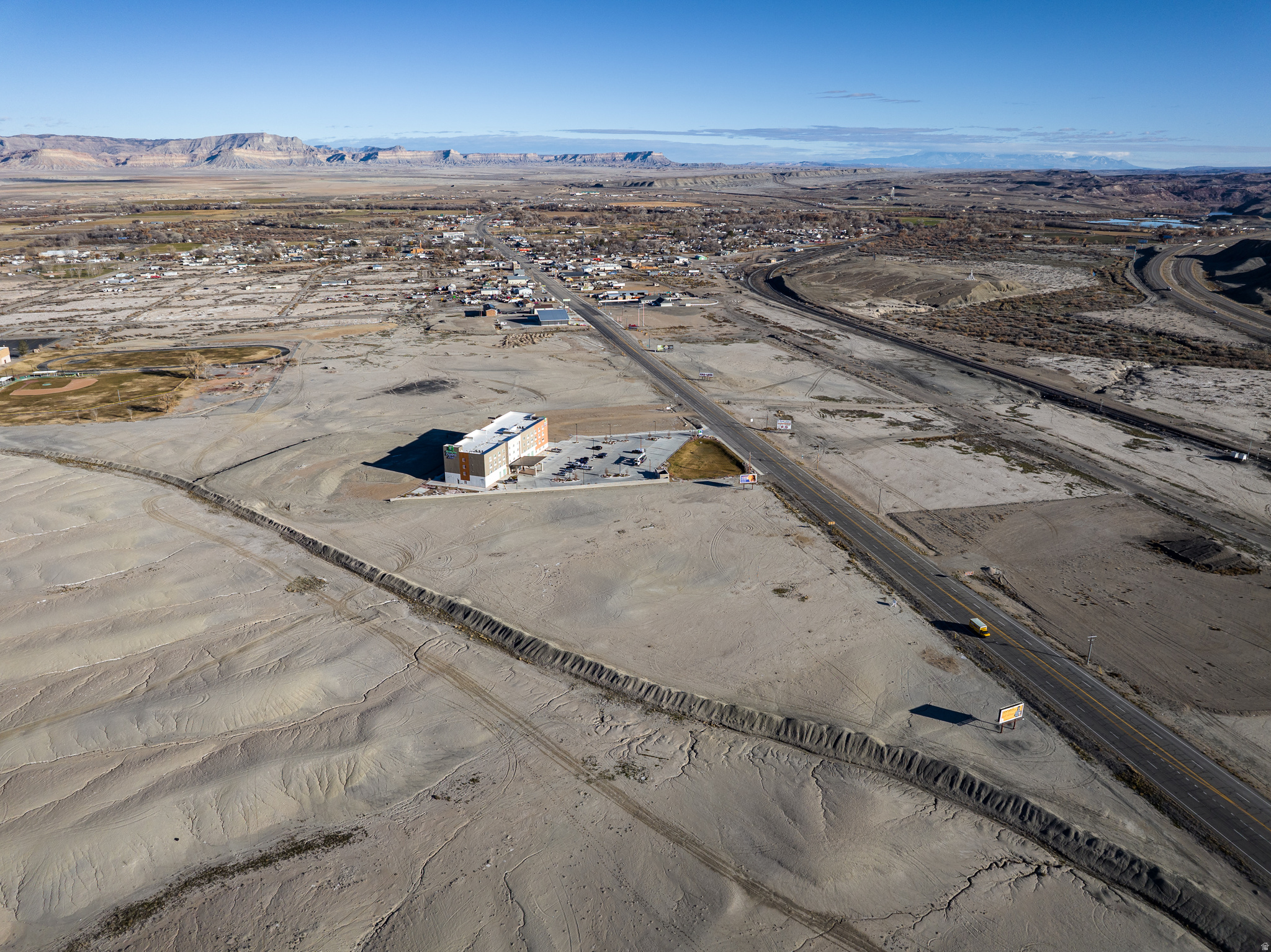 Discover 41.92 acres of raw commercial-zoned (C-1/C-2) land just outside Green River's town limits, offering a rare chance for large-scale development, storage, industrial, or commercial projects. The parcel enjoys excellent visibility and easy access via the nearby corridor I-70, making it ideal for highway-oriented businesses, distribution, or traveler-focused enterprises. With wide frontage, level terrain, and a blank canvas ready for infrastructure, this tract is a developer's dream. Located within reach of recreation destinations and growing regional traffic, the land combines strategic location with long-term potential. Don't miss this opportunity.
