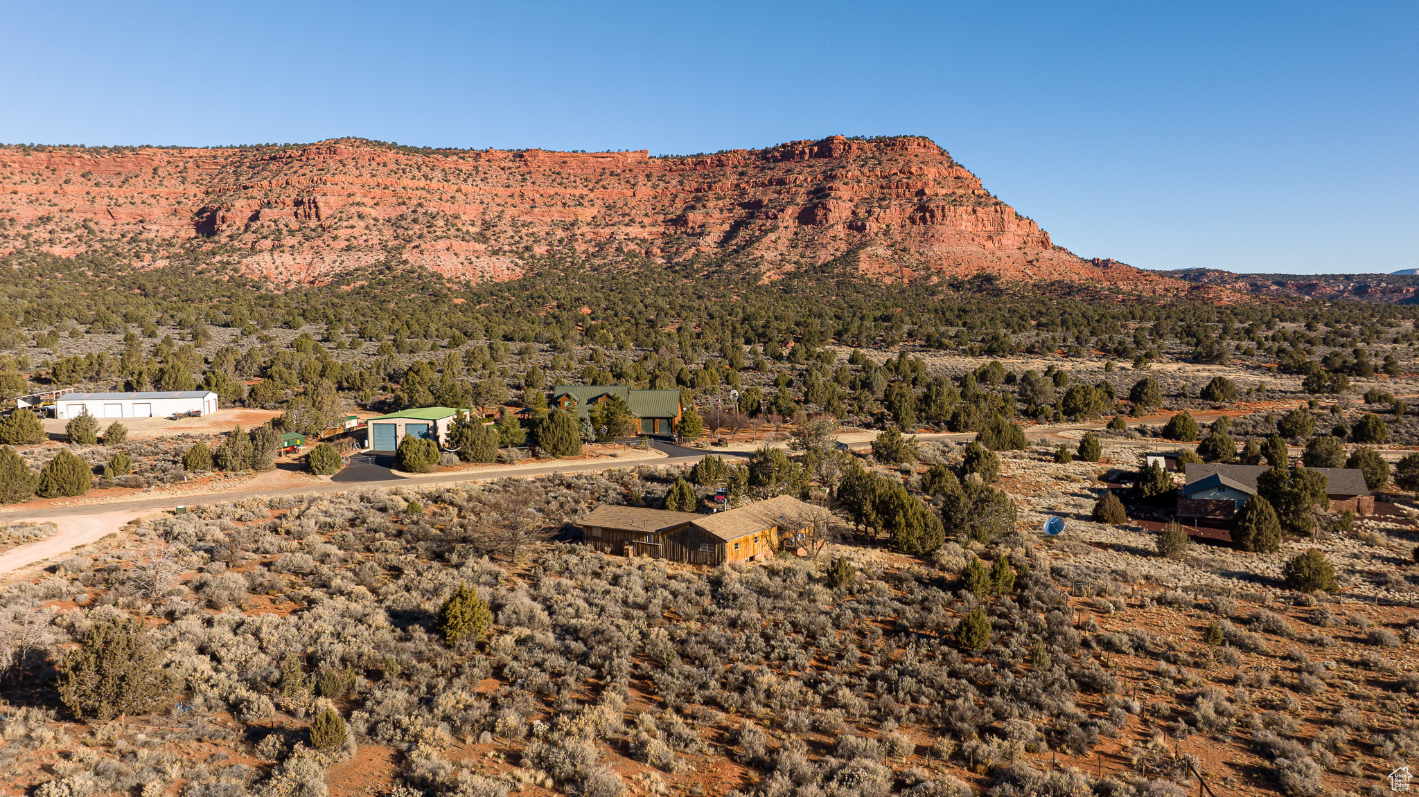 This is a rare opportunity to own a truly exceptional piece of high desert paradise with majestic red rock scenery and sweeping panoramic sky views in every direction. The existing home is being sold as-is and the value is in the land, location, and incredible potential. Financing will likely need to be land-based or cash. Seller is a patient investor and Certified Appraiser who understands the value of this unique property. Written offers only. Whether you envision building your dream retreat, creating a private getaway, or simply investing in a spectacular setting, this property offers the chance to make it your own in one of Southern Utah's most beautiful landscapes.