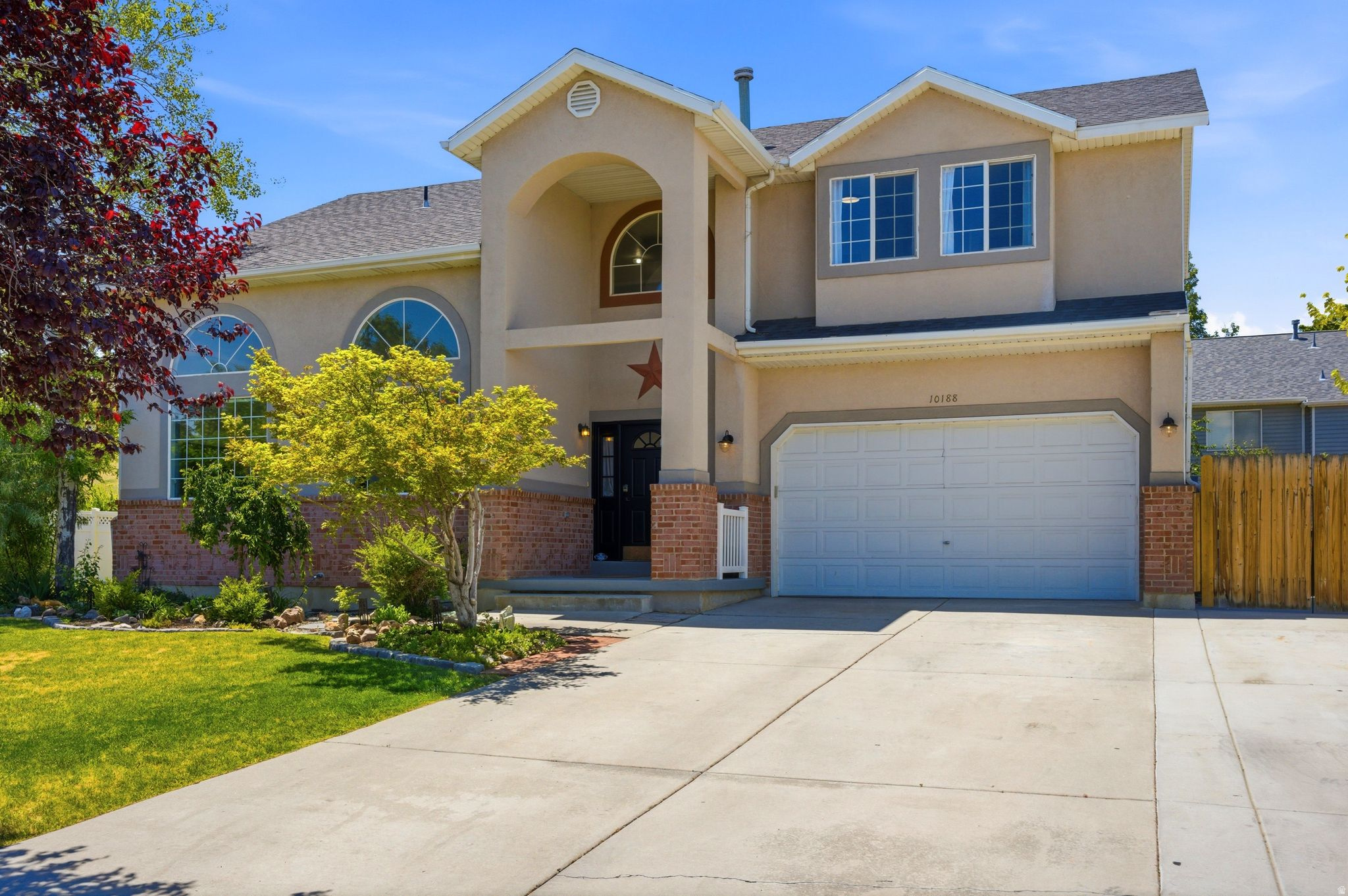 Beautiful 2-Story Home on an Expansive Corner Lot! This open and bright home offers an ideal layout for both entertaining and everyday living with NO HOA fee. The spacious living room and formal dining room are connected by a charming double-sided fireplace, creating a warm and inviting atmosphere. The large kitchen opens to a generous deck overlooking the fully fenced and landscaped backyard with mature trees. The finished basement provides additional entertainment space and abundant storage. Upstairs, the spacious primary suite features vaulted ceilings, a walk-in closet, double vanity, and separate tub and shower. Three additional bedrooms and a convenient upstairs laundry room complete the second level. Located on a desirable corner lot near Daybreak, shopping, dining, parks, and recreation, this home combines space, comfort, and an exceptional location. Square footage figures are provided as a courtesy estimate only and were obtained from the county tax records.  The buyer is advised to obtain an independent measurement.