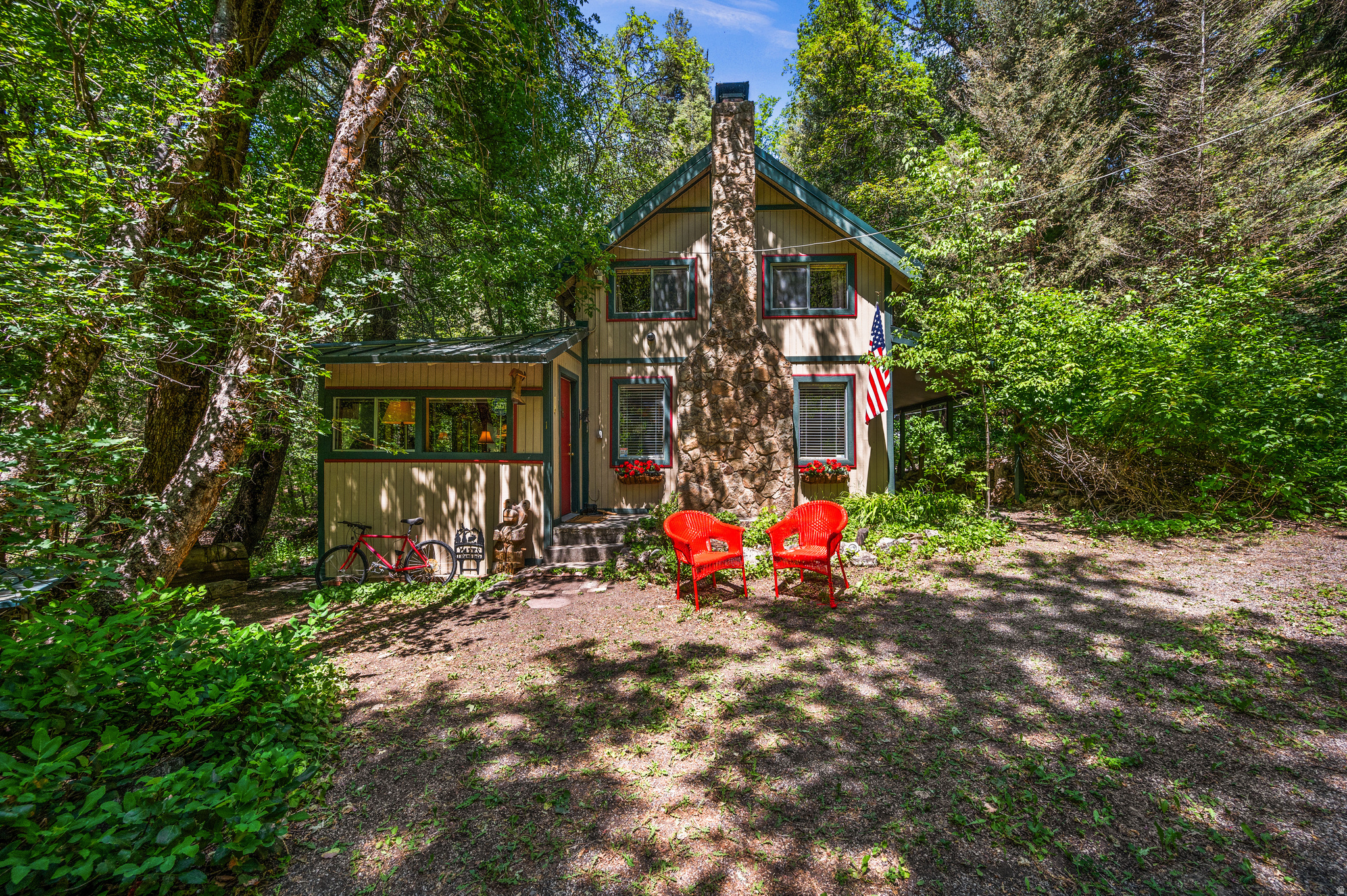 This Quintessential Cabin is located in the Porter Fork gated community off of Millcreek Canyon Rd. Situated alongside Porter Fork Creek, nestled amongst the trees. Enjoy the rustling sounds of the creek off the spacious deck, where you can entertain or relax in this mountain retreat. Inside, you will find the fully furnished rustic vibe you are looking for. Beautiful wood, fireplace, vaulted ceilings, and a spacious, well-equipped kitchen will allow you to comfortably enjoy all of the festivities. The main bedroom is located upstairs, and the den offers additional sleeping spaces. Easily sleeps 7 people! This is the first cabin in the subdivision that allows easy access. The road is not maintained in winter, and there is no winter water, but you can walk, snowcat, or snowmobile into your cabin during the winter months. Just a short walk (.16 miles) away from the gate. This is the perfect getaway, just 20 minutes from town. The cabin is on a recreational use permit issued by the US Forest Service, which is due to be renewed in 2028. The 2026 Annual USFS lease fee is $3,361.00. No rentals allowed. The cabin is being sold furnished and in as-is condition.