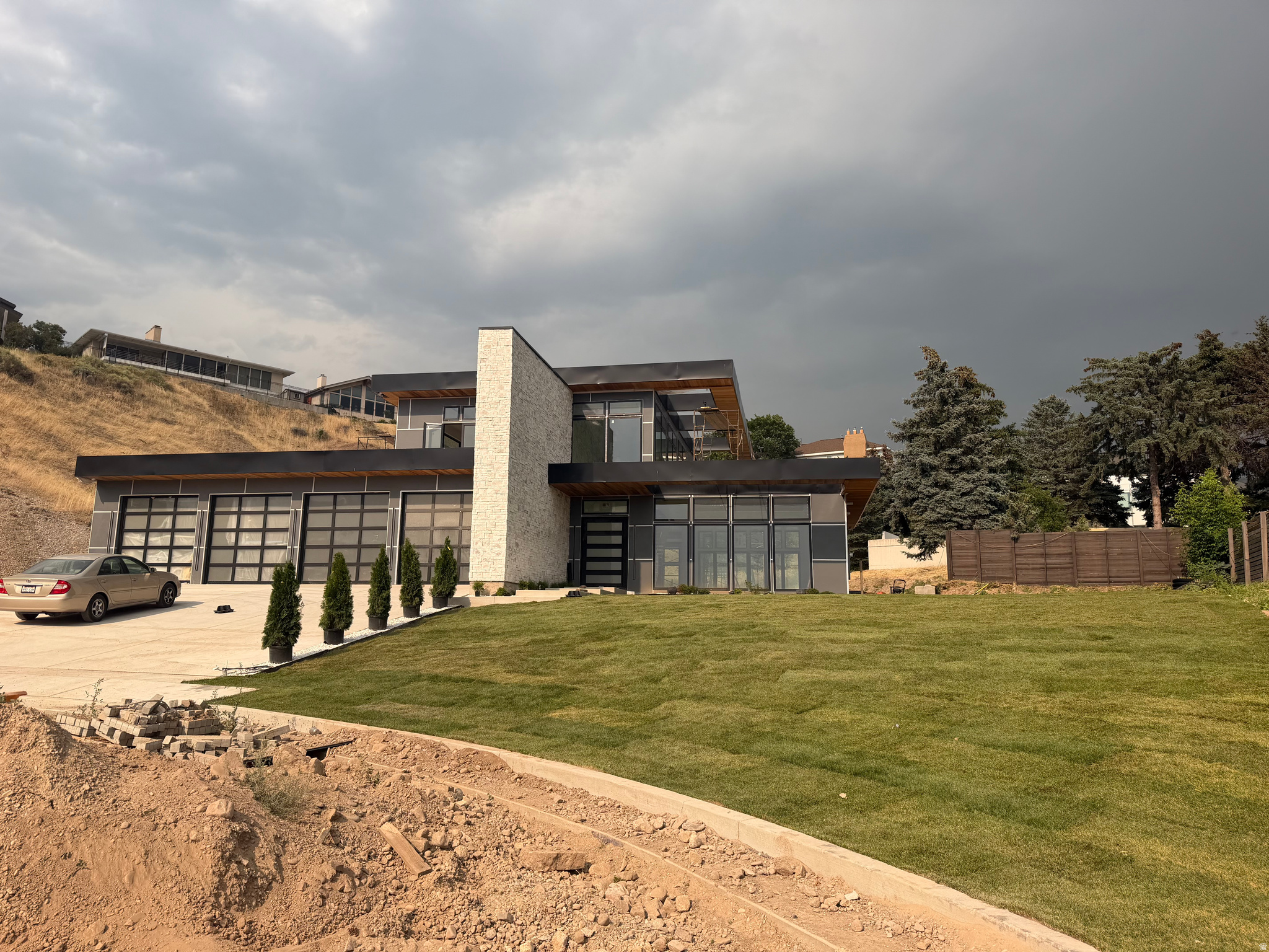 With nearly 5.5 acres, You can enjoy your own private street, create your own park  or subdivide the property to create additional lots. Discover elevated modern living in this extraordinary custom estate, a celebrated architectural design originally recognized as Canada's #1 home and now thoughtfully reimagined in one of Salt Lake City's most coveted neighborhoods. Set on a private cul-de-sac near the top of Virginia Street, the property captures sweeping, unobstructed views of the Salt Lake Valley. Designed for today's lifestyle, the open-concept floor plan is anchored by expansive floor-to-ceiling windows that create a seamless connection between indoor and outdoor spaces while flooding the home with natural light. The main living areas flow effortlessly, offering both functionality and architectural impact. The great room showcases a chef-inspired kitchen with Subzero and THOR appliances and generous family space, finished with custom cabinetry and refined millwork-ideal for entertaining or everyday living. A dramatic floating staircase leads to spacious bedroom suites and rooftop patios designed to take full advantage of the home's elevated setting. The lower level is dedicated to leisure and retreat, featuring a private swim spa, home theater room and a sophisticated lounge with full bar. Private showings are available by appointment. This home is nearing completion. Schedule an appointment to see it beforehand to allow the builder to complete changes for your needs.