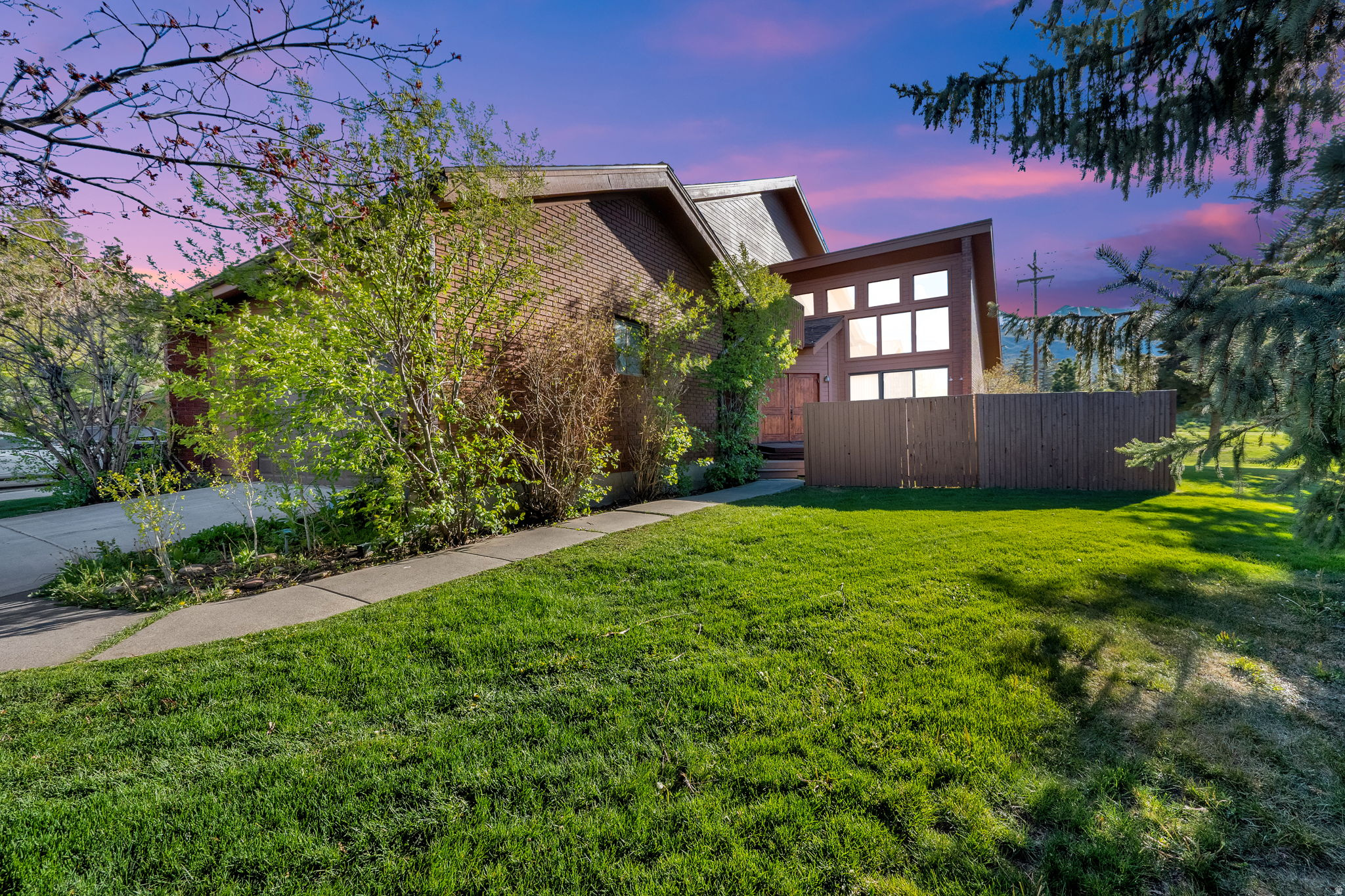 Ideally located in the heart of Park City, this exceptional end-unit townhome offers the perfect blend of mountain lifestyle, convenience, and investment potential, zoned for nightly rentals and year-round recreation. Just a short walk to the Canyons Cabriolet for easy access to Park City Mountain Resort, and minutes from Historic Main Street and Kimball Junction, this incredible home delivers unmatched accessibility to world-class skiing, dining, shopping, and entertainment. With nearby Matt Knoop Park connecting you to an extensive trail system for hiking, biking, cross-country skiing, and snowshoeing, endless possibilities are right at your fingertips! The main-level great room showcases soaring vaulted ceilings and a dramatic wall of windows, filling the space with natural light and framing beautiful ski slope mountain views. Two cozy woodburning brick fireplaces with front and back decks create seamless indoor-outdoor living. Just imagine unwinding after a day on the slopes in the private hot tub under the starry sky! The upper-level primary suite is a true retreat, complete with a private balcony with beautiful mountain views and features a generous loft or office space overlooking the dining area. The lower level provides additional living space perfect for entertaining or relaxing, featuring two fireplaces and two spacious bedrooms. Enjoy abundant storage, granite countertops, and beautiful tile throughout entire home! Completing the home is an attached two-car garage with ample space for vehicles and all your gear, making it easy to fully embrace the Park City lifestyle. Whether you're seeking a peaceful mountain getaway, full-time residence, or income-producing rental property, this townhome in quiet Park West Village neighborhood truly offers the best of both worlds! SOLD FURNISHED and ready for your immediate enjoyment!