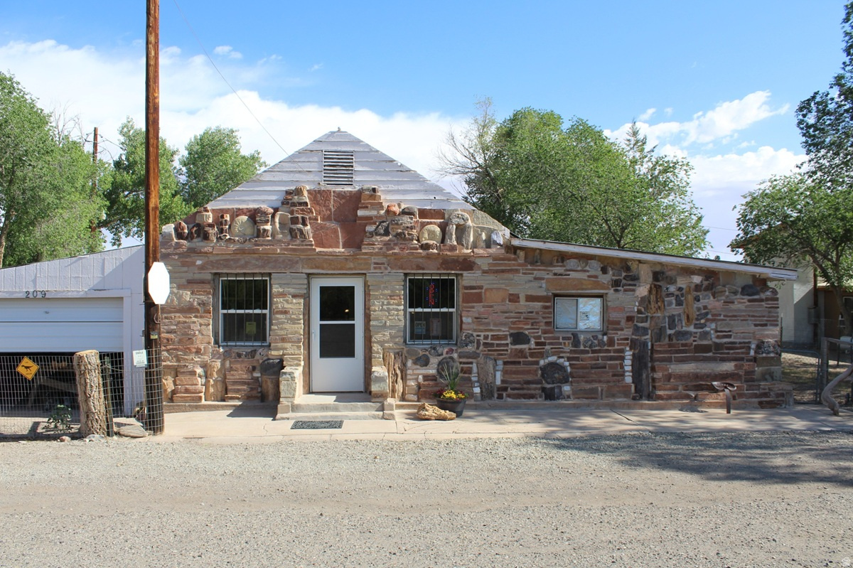 Rockin Riddle Rock Shop Located along Utah's iconic Scenic Byway 24 in the heart of red rock country, the Rockin Riddle Rock Shop in Hanksville offers a rare opportunity to own a well-known destination business surrounded by some of the Southwest's most spectacular landscapes and miles of public lands. Serving travelers, rockhounds, tourists, and outdoor enthusiasts year round, this unique property combines small town charm with steady tourism traffic from nearby Capitol Reef National Park, Henry Mountains, Goblin Valley, Lake Powell, and the San Rafael Swell. The Rockin Riddle Rock Shop is well known as a memorable stop for visitors exploring Southern Utah. With excellent highway visibility, established customer recognition, and endless potential for expansion into retail, lodging, tours, or specialty experiences, this property is ideal for entrepreneurs seeking both lifestyle and business opportunity. In addition to the retail business, the property includes a comfortable two-bedroom, two-bath home situated on 1.81 acres, offering the perfect blend of business ownership and desert living. The spacious acreage provides room for expansion, additional income opportunities, RV parking, or future development possibilities. This property combines an established business reputation in harmony with the authentic charm and adventure of the American Southwest. Square footage figures are provided as a courtesy estimate only and were obtained from county records. Buyer is advised to obtain an independent measurement.