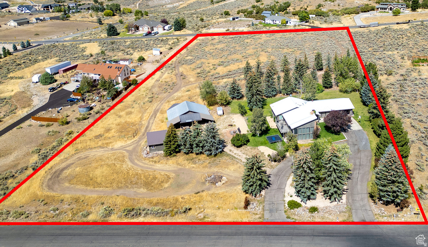 Rare opportunity to own a piece of Wasatch View Acres! Great home offering unique midcentury modern architecture situated on 5 acres with barn and workshop. Approx. 5100 sq feet offering 6 bedrooms, 3 bathrooms, walkout basement, updated kitchen and attached 2 car garage. Many possibilities with this great home and property! Perched above Heber, this great location offers stunning mountain and valley views with easy access to city amenities and schools. 55 minutes to SLC international airport, 40 minutes to Provo/Orem. Buyer to verify all.