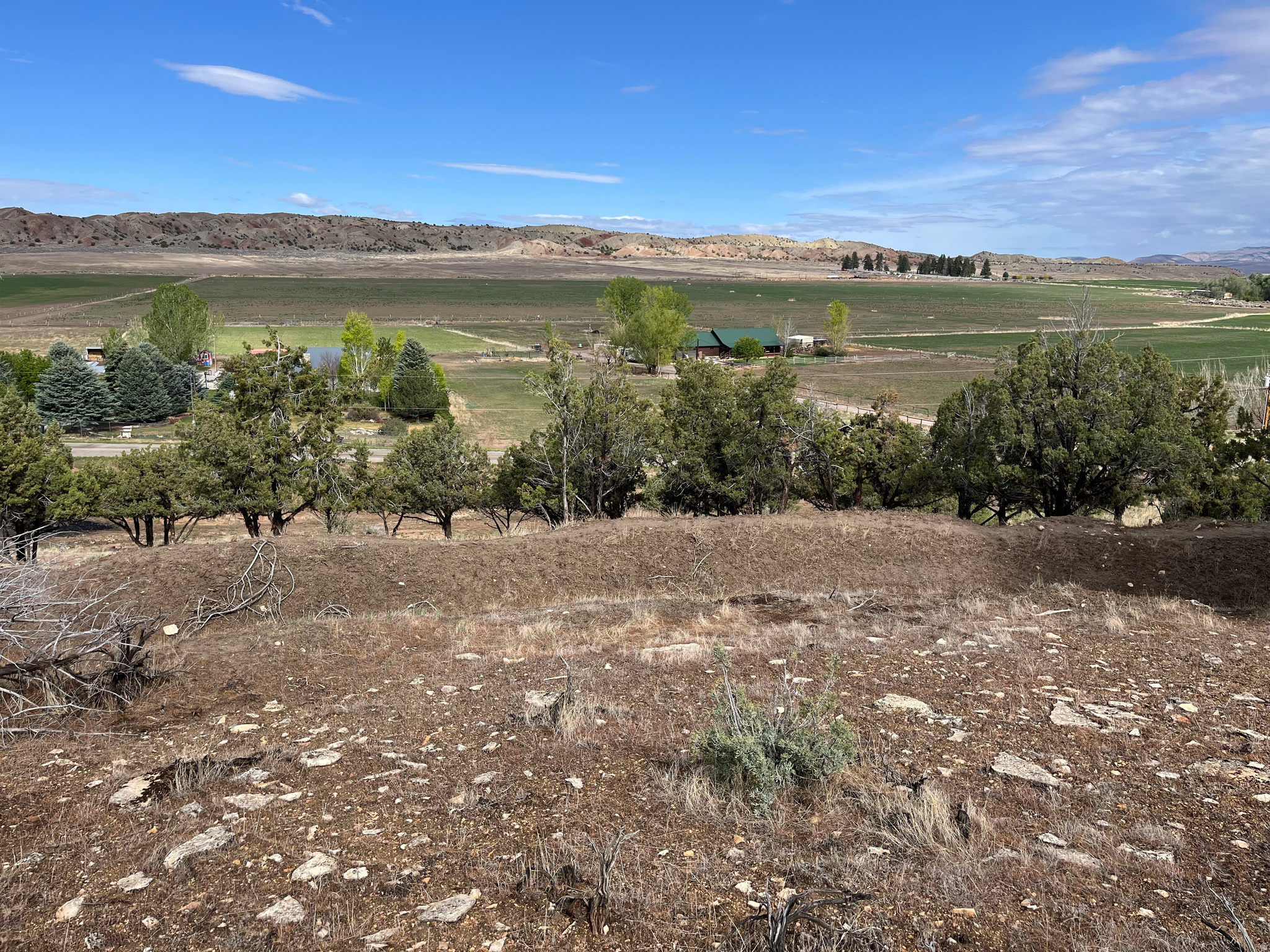 Build-Ready 2.81-Acre View Lot Nestled in a Beautiful Cove & Utilities in Place  1/2 mile outside of Mayfield Town.  Escape to peaceful country living under wide-open skies and crisp fresh air on this rare, developed building lot.  Culinary water is stubbed from an extra-deep, newly drilled shared well, complete with 1 acre-foot water right.  Electricity is also stubbed to the property, making this  parcel ready for your custom home.  Choose your ideal setting: build close to the front for easy access or nestle your home back into the cove between the hills. Enjoy breathtaking panoramic views of rolling countryside framed by spectacular mountain ranges, with unforgettable sunsets painting the horizon.  Just minutes from the entrance to 12 Mile Canyon, endless recreation awaits - world-class off-roading, hiking, camping, fishing, backpacking, and more. Conveniently close to grocery stores, gas, golfing, excellent schools, and a charming town park, this lot perfectly balances serene rural retreat with everyday amenities.  Whether you're seeking a full-time home, a peaceful part-time escape, or a private getaway, this versatile property offers endless possibilities. Septic system required; perc test has already been completed.  Agent is related to the seller.  Acreage is per county records for convenience; buyer to verify.  Recent survey available upon request.  Come experience the serenity and imagine the lifestyle this beautiful land can provide. Don't miss your chance to build the home of your dreams in this idyllic setting.