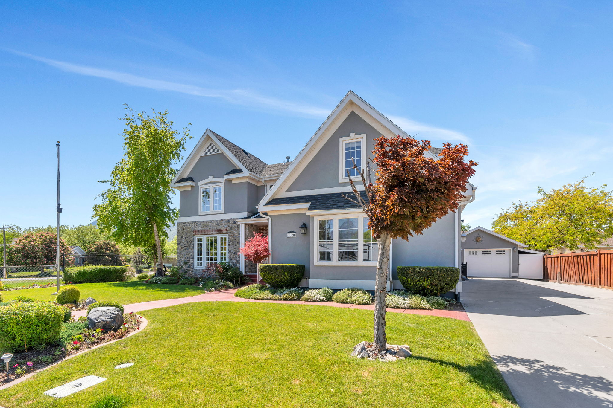 Located in one of Spanish Fork's most desirable neighborhoods, this spacious home offers the perfect blend of functionality, comfort, and flexibility. With generous living spaces, abundant storage throughout, and a thoughtful floor plan, there's room for everyone to spread out and feel at home. The main floor features a dedicated office-ideal for working from home-as well as a formal dining room perfect for hosting gatherings and special occasions. Retreat to the luxurious primary suite featuring a spacious bedroom, spa-like bathroom, and the kind of comfort and privacy that makes it feel like your own personal getaway. The fully finished basement apartment includes a separate entrance and its own kitchen, creating an excellent opportunity for multi-generational living or for guests. Outside, you'll love the beautifully designed outdoor living spaces made for BBQs, entertaining, and relaxing evenings with friends and family. A detached garage provides even more room for vehicles, hobbies, toys, or storage in addition to the attached garage. You'll love the radiant heated driveway to melt the snow in winter. Situated next to a park in an excellent neighborhood, this property combines space, versatility, and location in a way that's hard to find.