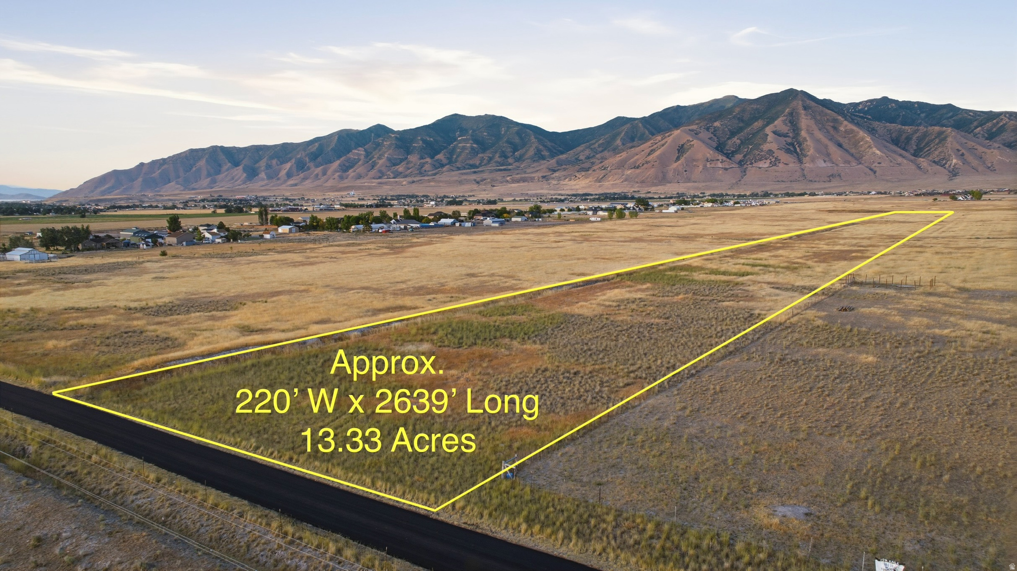 Rare opportunity to own 13.33 acres in the heart of Erda with paved road frontage, panoramic mountain views, and exceptional long-term potential. This level, usable property is ideal for farming, livestock grazing, pasture, or long-term investment, offering the peace and beauty of Utah's rural landscape in one of Tooele County's fastest-growing communities. Don't miss your chance to own this exceptional acreage with endless possibilities. RR-5 zoning.  Buyer responsible for any Greenbelt Taxes due at closing.  Buyer to verify utilities, zoning, and future land use opportunities. Outlines are approximations of boundaries.  Buyer to verify all.  Seller related to Agent.
