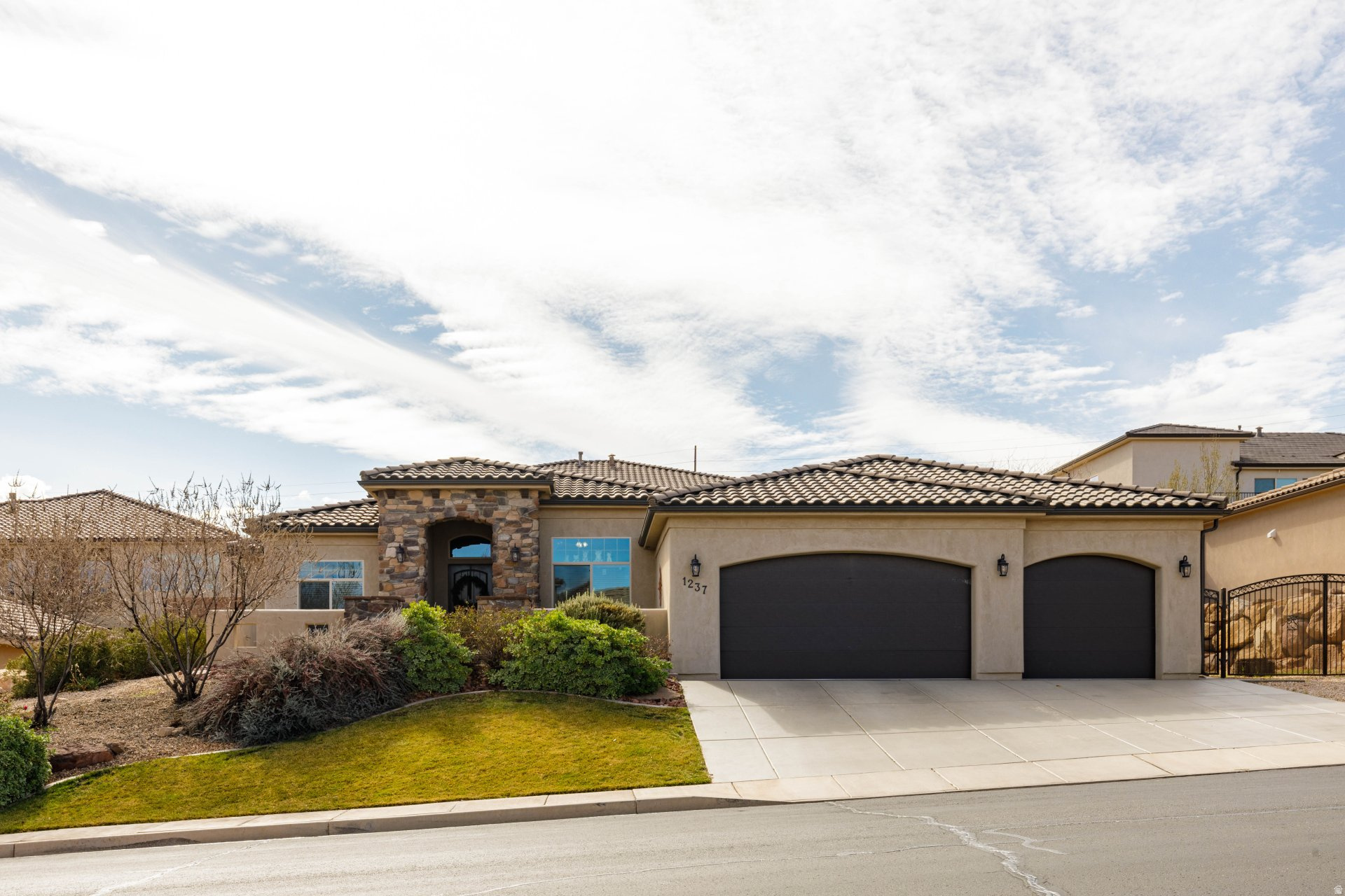 Beautifully designed single-level home featuring an open, functional layout and high-quality finishes throughout. The spacious great room is highlighted by a stunning stone fireplace, tray ceiling, and large windows that bring in abundant natural light while creating a warm, inviting atmosphere. The gourmet kitchen offers rich custom cabinetry, granite countertops, stainless steel appliances, expansive island seating, and seamless flow into the dining and living areas--ideal for both everyday living and entertaining. This home features a whole home water filter system. The oversized primary suite provides a private retreat with generous space, direct patio access, dual vanities, large walk-in shower, soaking tub, and an impressive walk-in closet.  Additional bedrooms are well-sized and thoughtfully positioned for comfort and privacy. A well-appointed laundry room with abundant cabinetry and workspace adds everyday convenience.  Exterior features include a charming front courtyard, attractive stone and stucco elevation, and a private backyard with covered patio, mature landscaping, and rock retaining walls that create a peaceful outdoor setting. The oversized garage provides ample parking and storage.  Located in a desirable neighborhood with beautiful surrounding homes, this property offers an exceptional combination of comfort, quality, and livability. Owner/Agent
